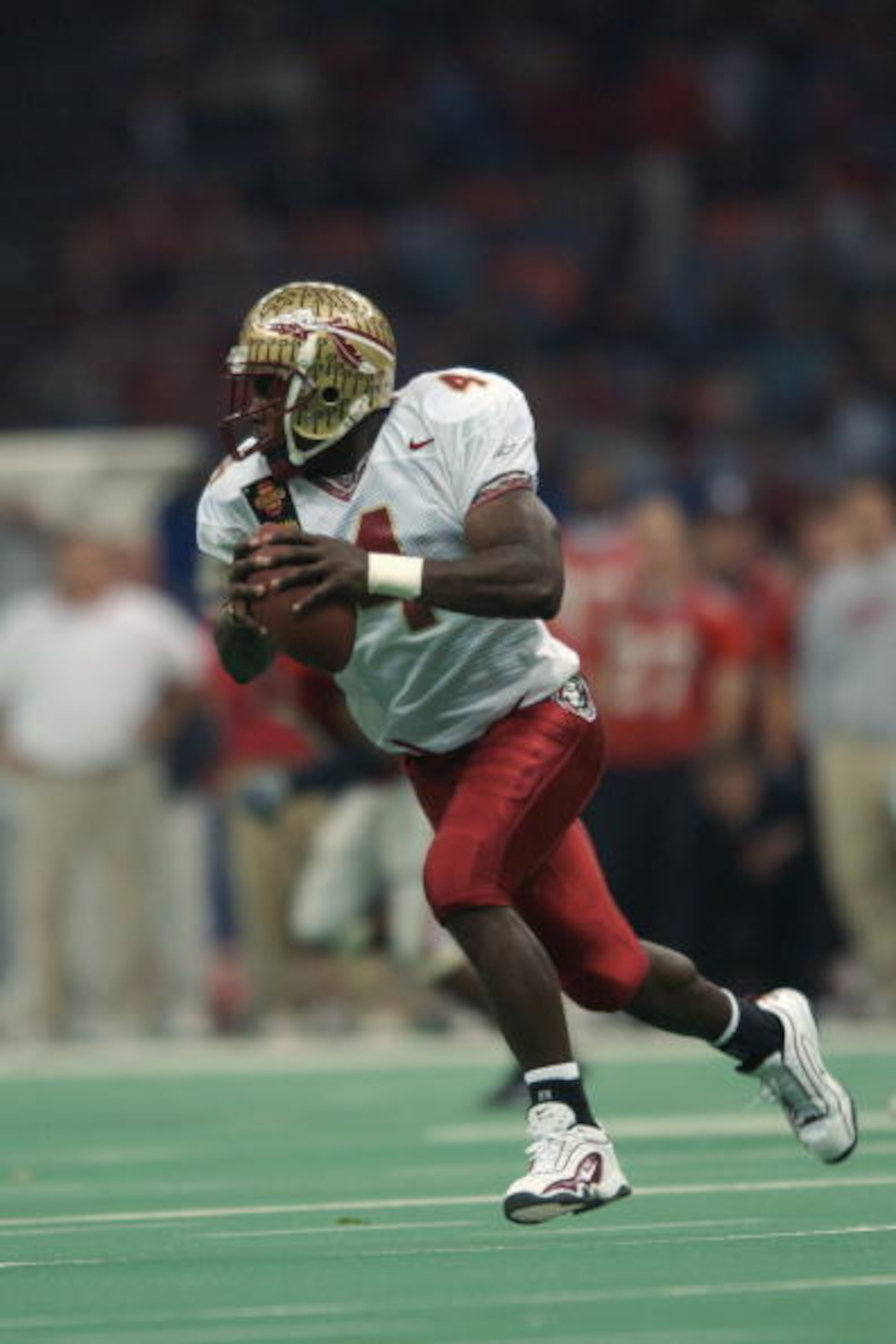NEW ORLEANS - JANUARY 1: Wide receiver Anquan Boldin #4 of the Florida State University Seminoles carries the ball during the Nokia Sugar Bowl game against the University of Georgia Bulldogs at the Louisiana Superdome on January 1, 2003 in New Orleans, L NEW ORLEANS - JANUARY 1: Wide receiver Anquan Boldin #4 of the Florida State University Seminoles carries the ball during the Nokia Sugar Bowl game against the University of Georgia Bulldogs at the Louisiana Superdome on January 1, 2003 in New Orleans, L