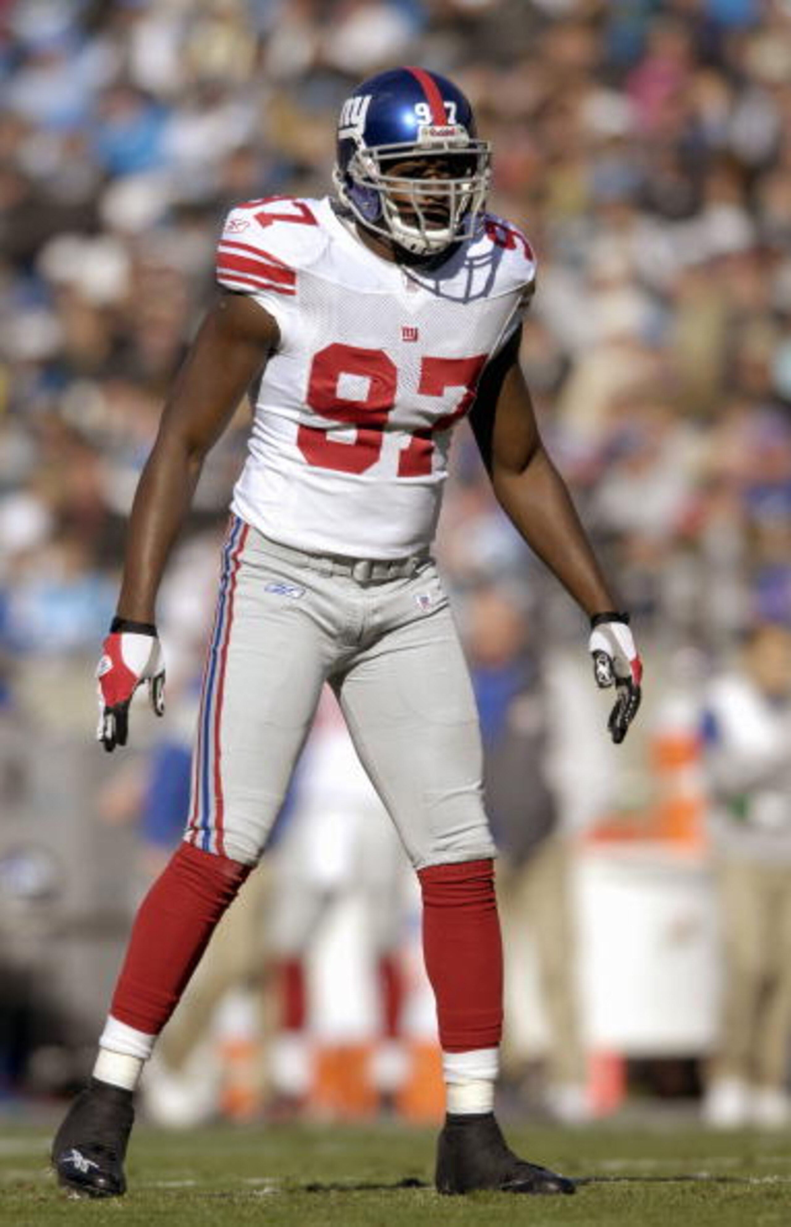 CHARLOTTE, NC - DECEMBER 10: Mathias Kiwanuka #97 of the New York Giants gets ready on the field during the game against the Carolina Panthers on December 10, 2006, at Bank of America Stadium in Charlotte, North Carolina. (Photo By Grant Halverson/Getty I