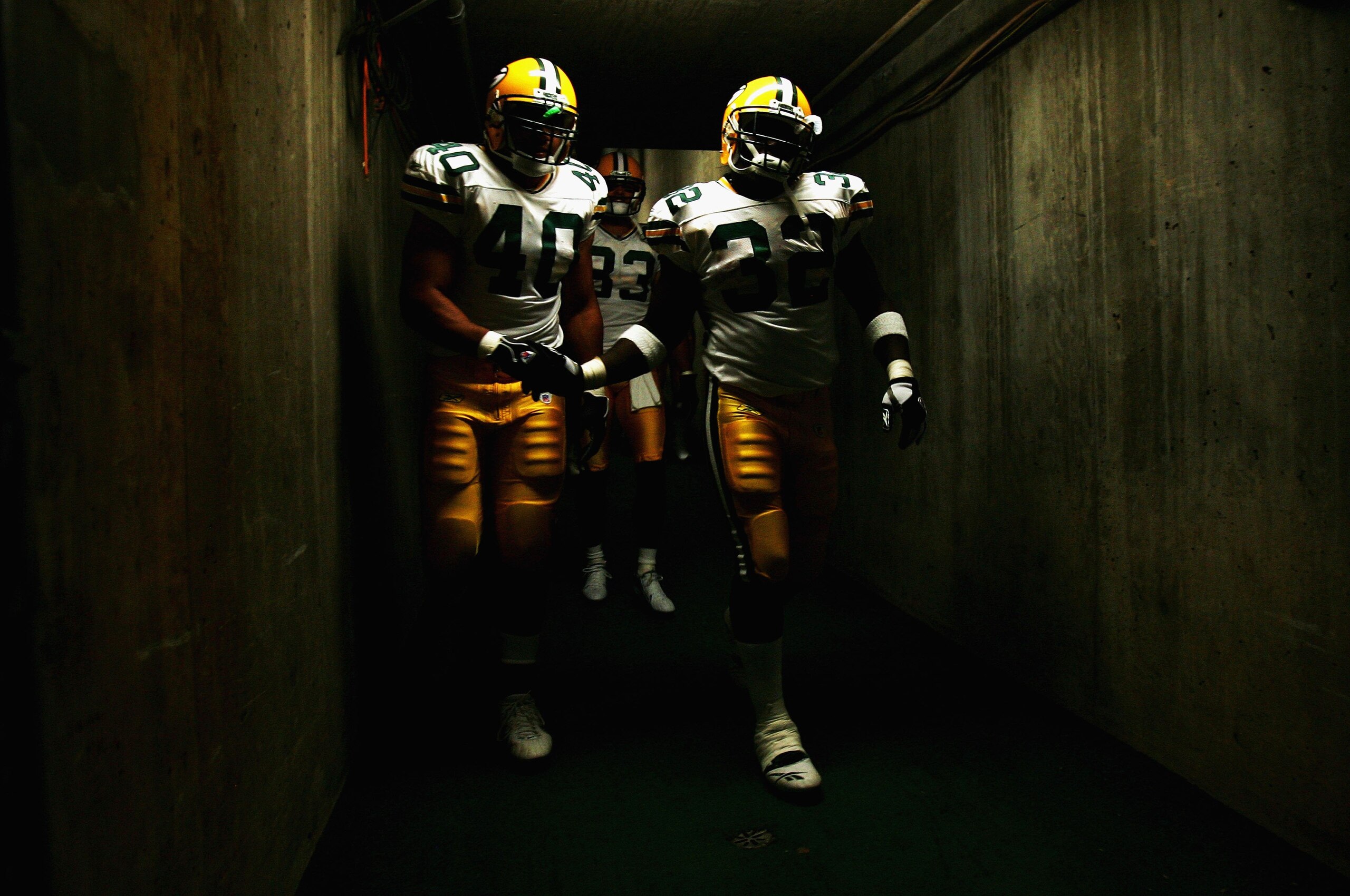 SAN DIEGO - AUGUST 12:  Fullback A.J. Cooper #40 and Running back Arliss Beach #32 of the Green Bay Packers enter the game from the stadium tunnel during their team's NFL Preseason game against the San Diego Chargers on August 12, 2006 at Qualcomm Stadium