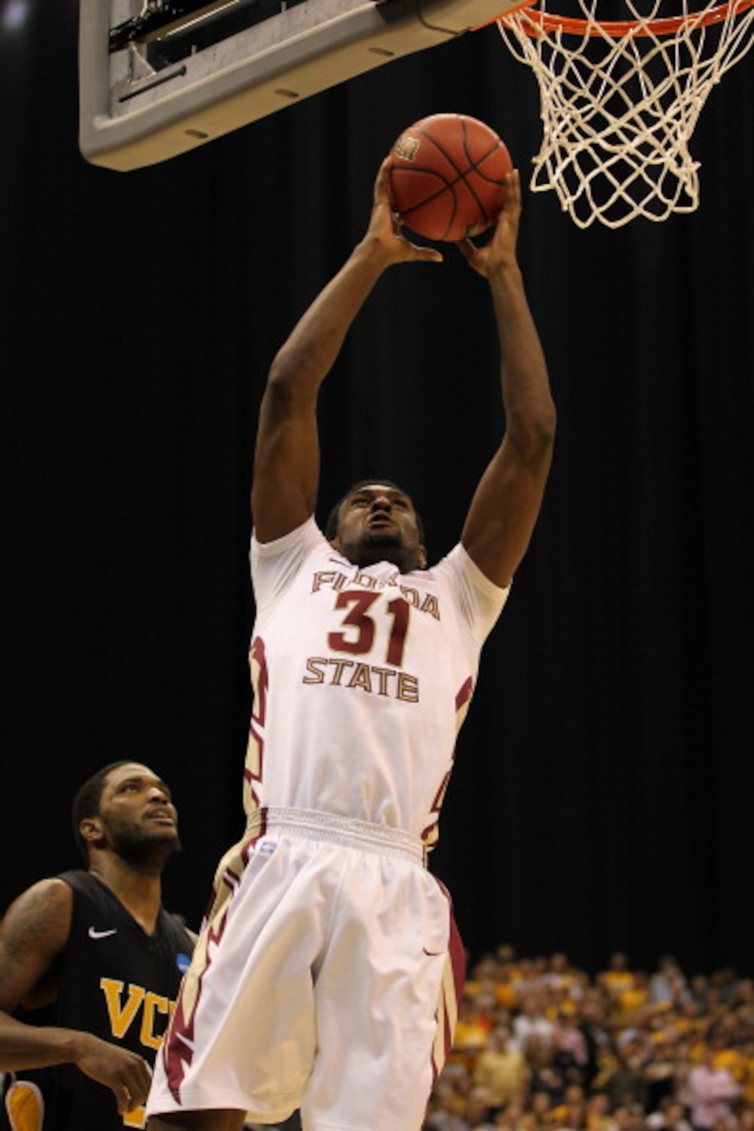 SAN ANTONIO, TX - MARCH 25: Chris Singleton #31 of the Florida State Seminoles goes to the basket against Jamie Skeen #21 of the Virginia Commonwealth Rams during the southwest regional of the 2011 NCAA men's basketball tournament at the Alamodome on Mar SAN ANTONIO, TX - MARCH 25: Chris Singleton #31 of the Florida State Seminoles goes to the basket against Jamie Skeen #21 of the Virginia Commonwealth Rams during the southwest regional of the 2011 NCAA men's basketball tournament at the Alamodome on Mar