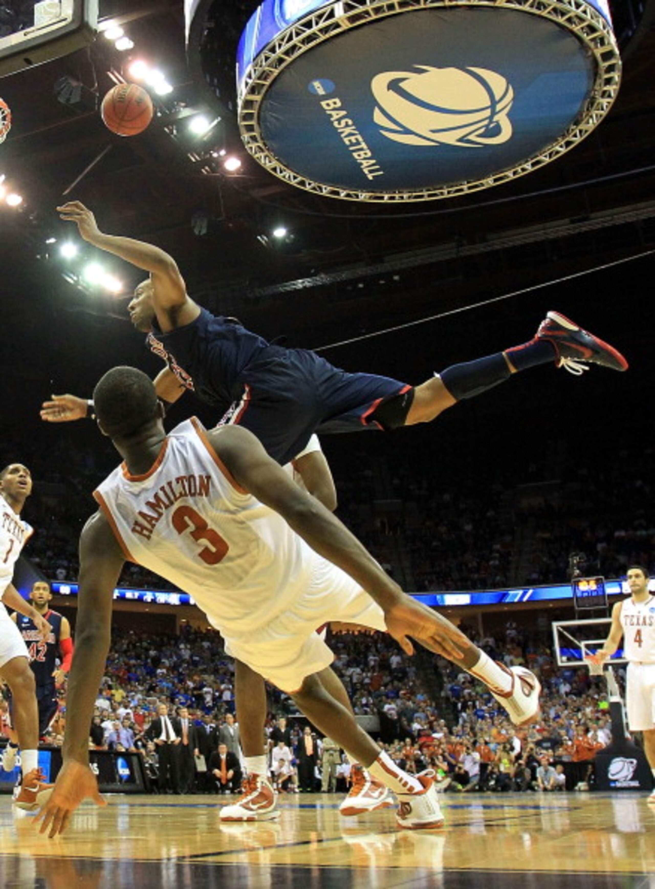 TULSA, OK - MARCH 20:  Derrick Williams #23 of the Arizona Wildcats is fouled by Jordan Hamilton #3 of the Texas Longhorns on the game tying shot during the third round of the 2011 NCAA men's basketball tournament at BOK Center on March 20, 2011 in Tulsa,