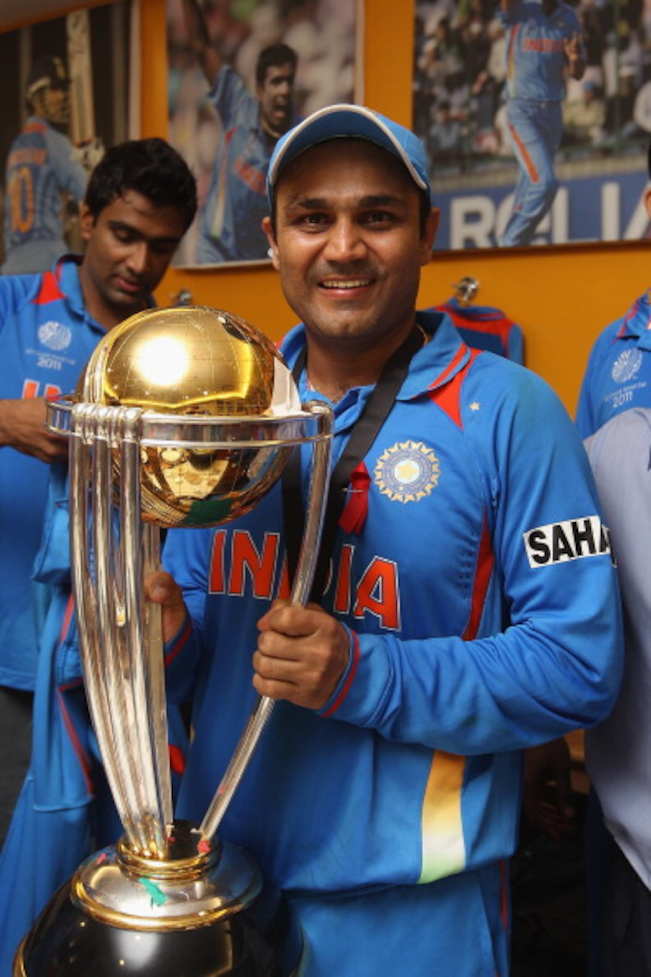 MUMBAI, INDIA - APRIL 02: Virender Sehwag of India poses with the World Cup trophy in the players dressing room after his side's six wicket victory in the 2011 ICC World Cup Final between India and Sri Lanka at Wankhede Stadium on April 2, 2011 in Mumbai MUMBAI, INDIA - APRIL 02: Virender Sehwag of India poses with the World Cup trophy in the players dressing room after his side's six wicket victory in the 2011 ICC World Cup Final between India and Sri Lanka at Wankhede Stadium on April 2, 2011 in Mumbai