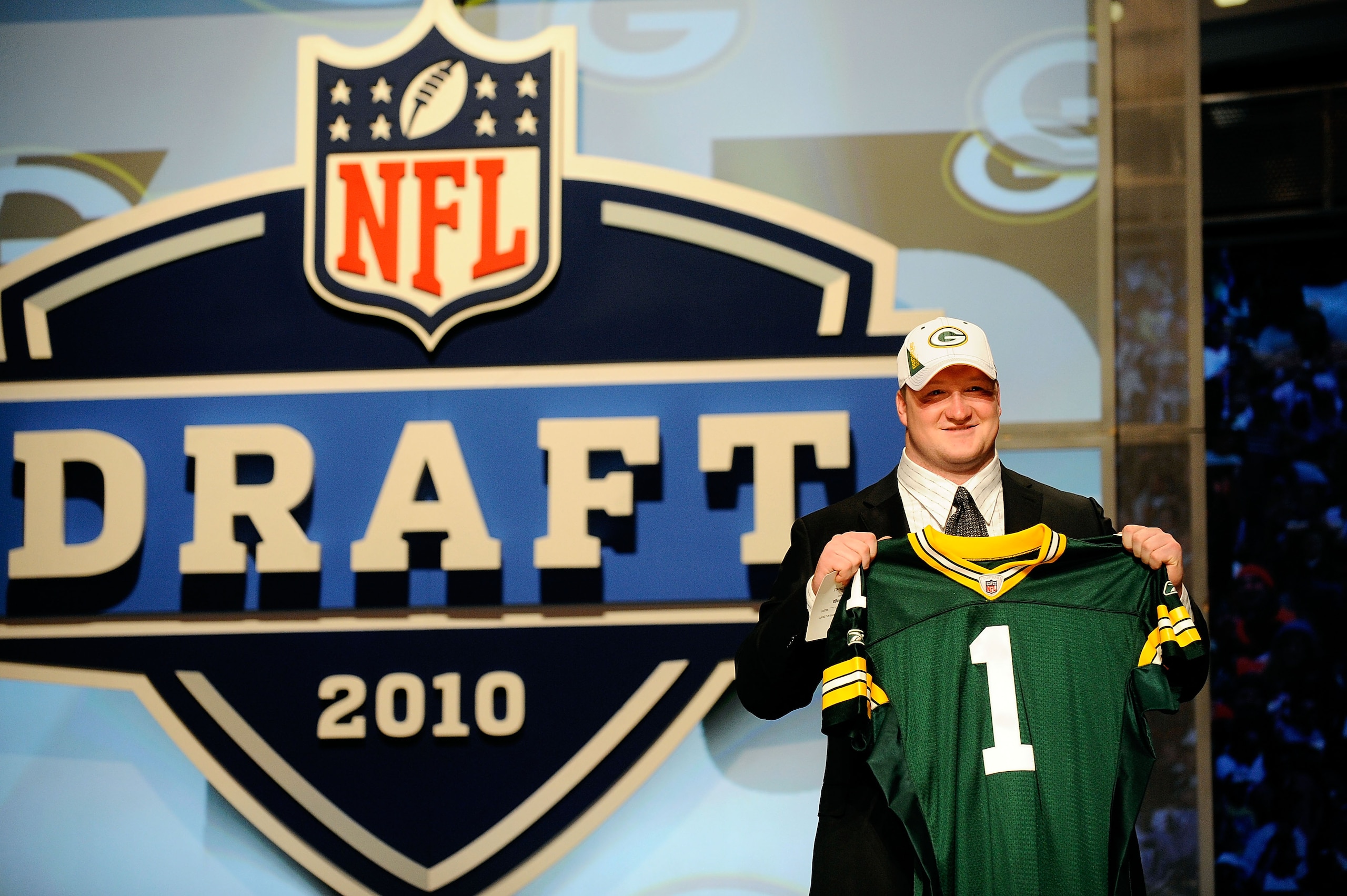 NEW YORK - APRIL 22: Bryan Bulaga from the Iowa Hawkeyes holds up a Green Bay Packers jersey after the Packers drafted him number 23 overall during the first round of the 2010 NFL Draft at Radio City Music Hall on April 22, 2010 in New York City. (Photo NEW YORK - APRIL 22: Bryan Bulaga from the Iowa Hawkeyes holds up a Green Bay Packers jersey after the Packers drafted him number 23 overall during the first round of the 2010 NFL Draft at Radio City Music Hall on April 22, 2010 in New York City. (Photo