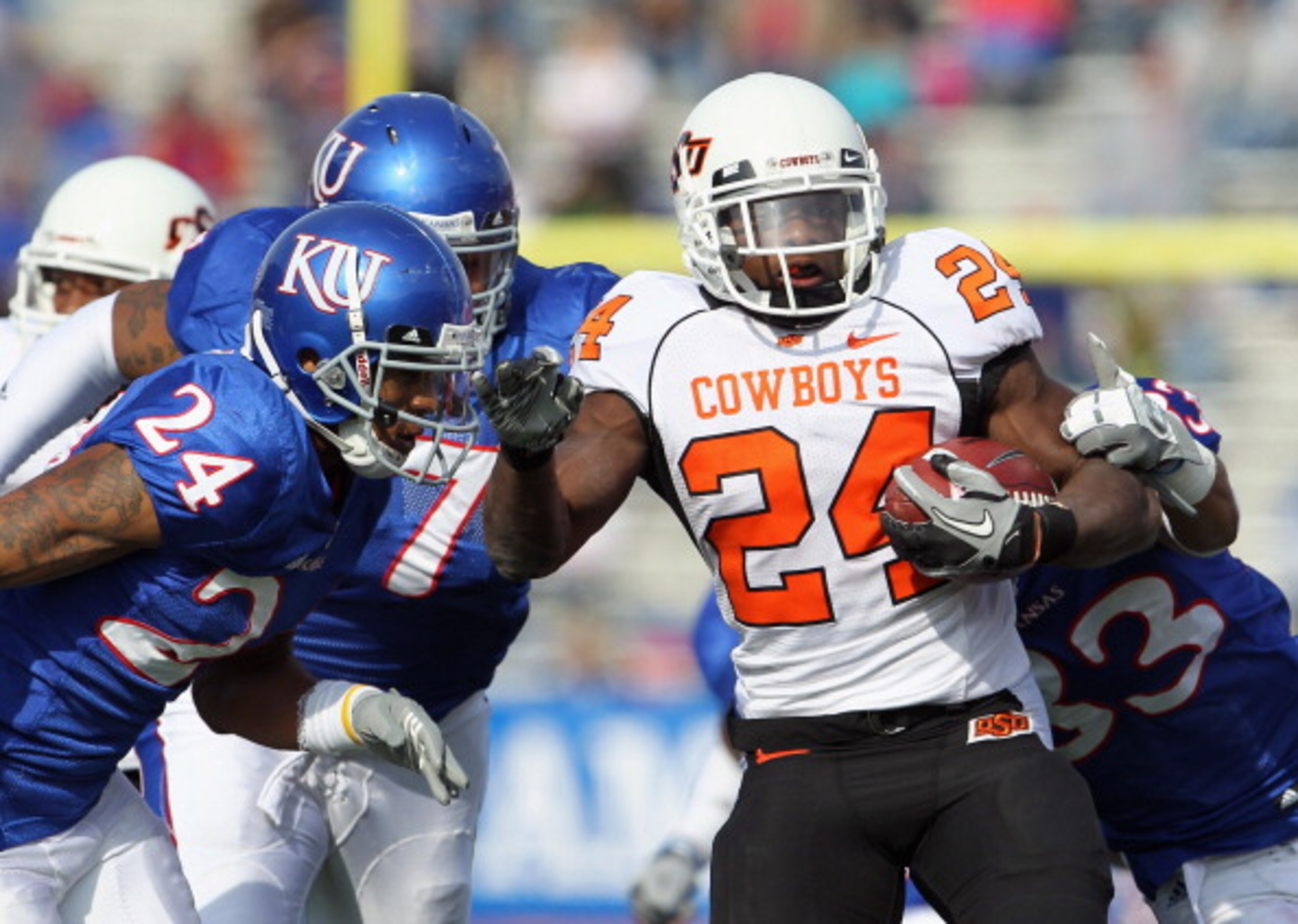 LAWRENCE, KS - NOVEMBER 20: Running back Kendall Hunter #24 of the Oklahoma State Cowboys carries the ball during the game against the Kansas Jayhawks on November 20, 2010 at Memorial Stadium in Lawrence, Kansas. (Photo by Jamie Squire/Getty Images) LAWRENCE, KS - NOVEMBER 20: Running back Kendall Hunter #24 of the Oklahoma State Cowboys carries the ball during the game against the Kansas Jayhawks on November 20, 2010 at Memorial Stadium in Lawrence, Kansas. (Photo by Jamie Squire/Getty Images)