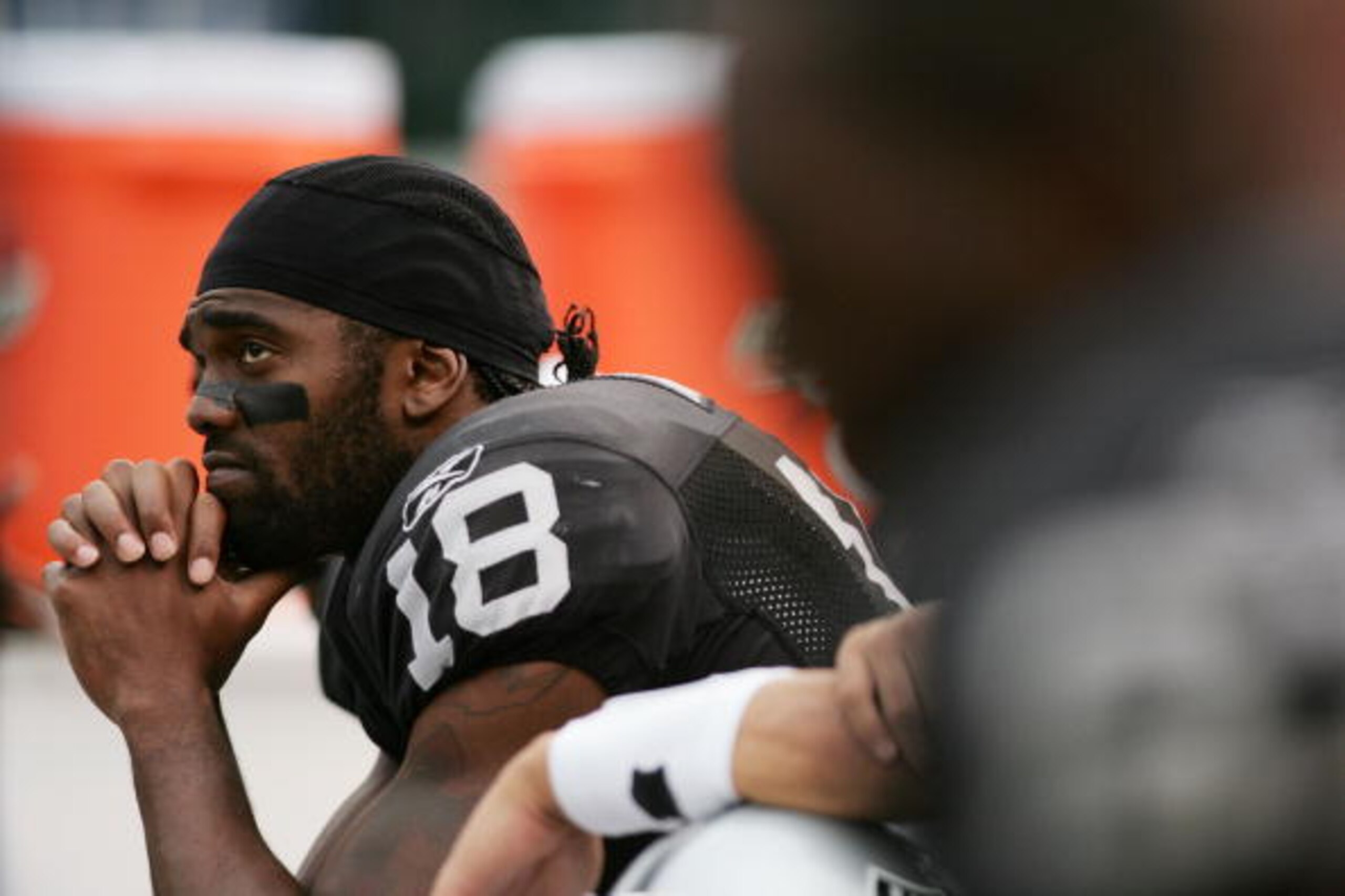 OAKLAND, CA - OCTOBER 01: Randy Moss #18 of the Oakland Raiders looks on towards the end of the game against the Cleveland Browns on October 1, 2006 at McAfee Coliseum in Oakland, California. The Browns defeated the Raiders 24-21. (Photo by Jonathan Fer OAKLAND, CA - OCTOBER 01: Randy Moss #18 of the Oakland Raiders looks on towards the end of the game against the Cleveland Browns on October 1, 2006 at McAfee Coliseum in Oakland, California. The Browns defeated the Raiders 24-21. (Photo by Jonathan Fer