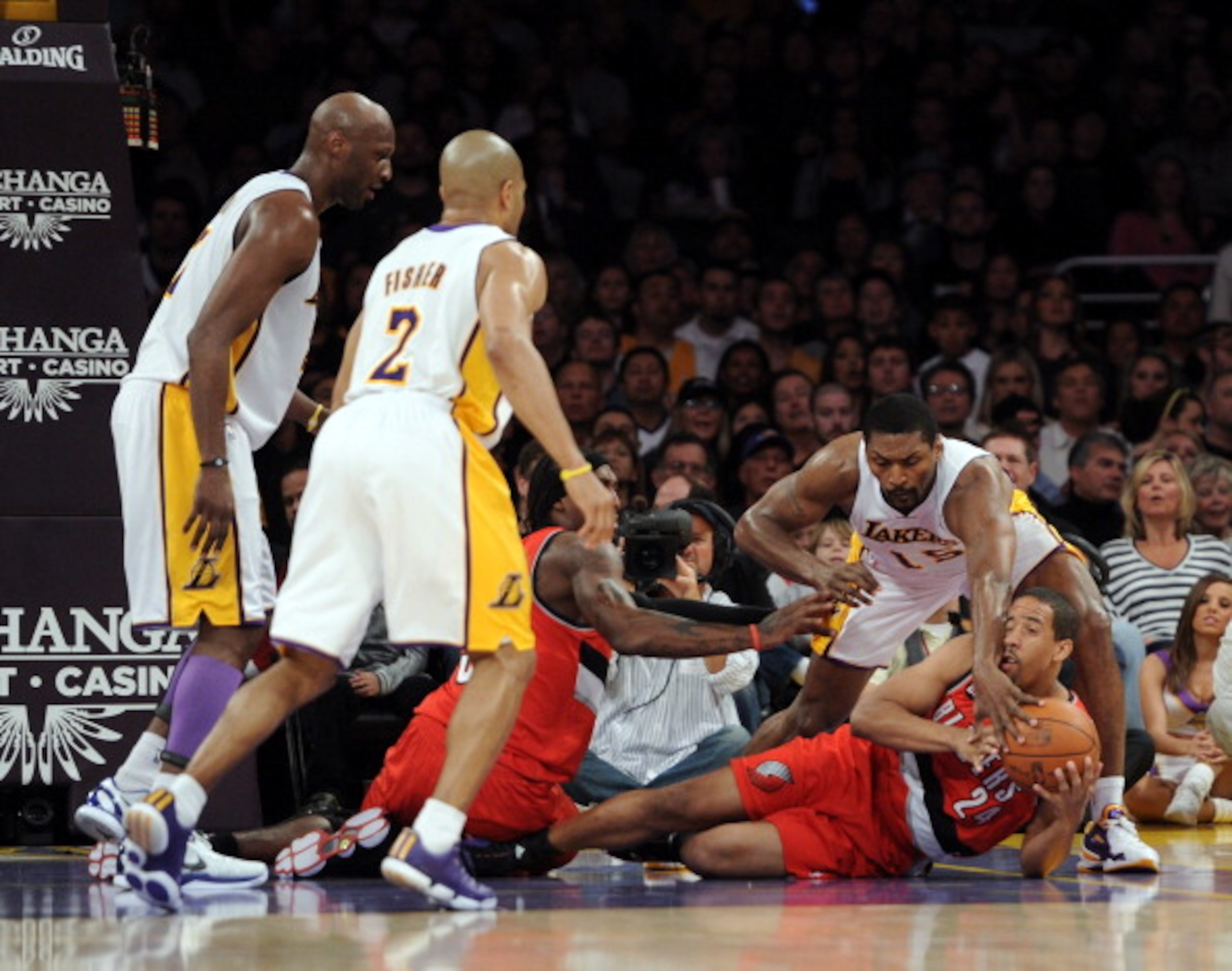 LOS ANGELES, CA - MARCH 20: Andre Miller #24 of the Portland Trail Blazers and Ron Artest #15 of the Los Angeles Lakers chase a loose ball at the Staples Center on March 20, 2011 in Los Angeles, California. NOTE TO USER: User expressly acknowledges and LOS ANGELES, CA - MARCH 20: Andre Miller #24 of the Portland Trail Blazers and Ron Artest #15 of the Los Angeles Lakers chase a loose ball at the Staples Center on March 20, 2011 in Los Angeles, California. NOTE TO USER: User expressly acknowledges and