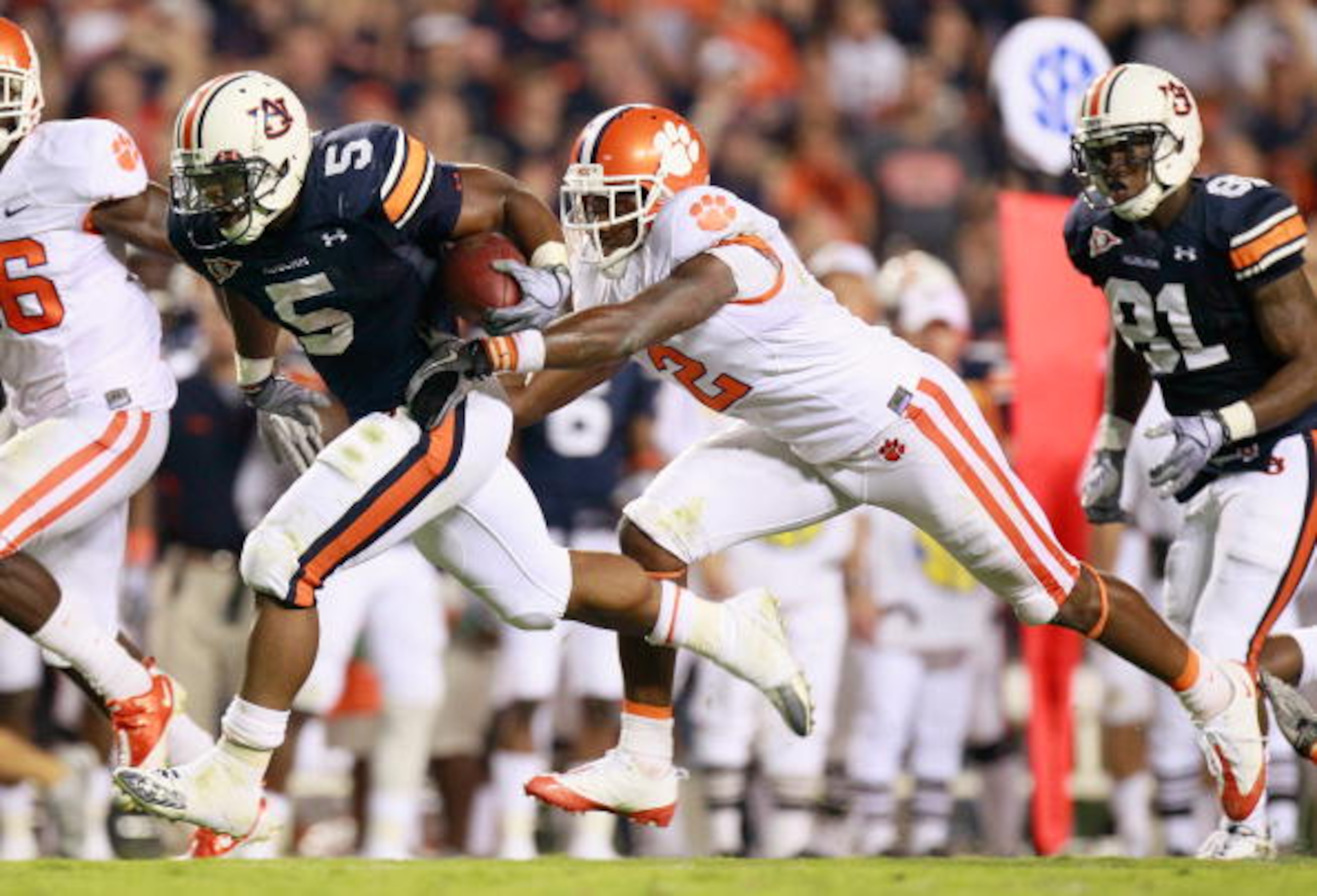 AUBURN, AL - SEPTEMBER 18: Michael Dyer #5 of the Auburn Tigers against DeAndre McDaniel #2 of the Clemson Tigers at Jordan-Hare Stadium on September 18, 2010 in Auburn, Alabama. (Photo by Kevin C. Cox/Getty Images) AUBURN, AL - SEPTEMBER 18: Michael Dyer #5 of the Auburn Tigers against DeAndre McDaniel #2 of the Clemson Tigers at Jordan-Hare Stadium on September 18, 2010 in Auburn, Alabama. (Photo by Kevin C. Cox/Getty Images)