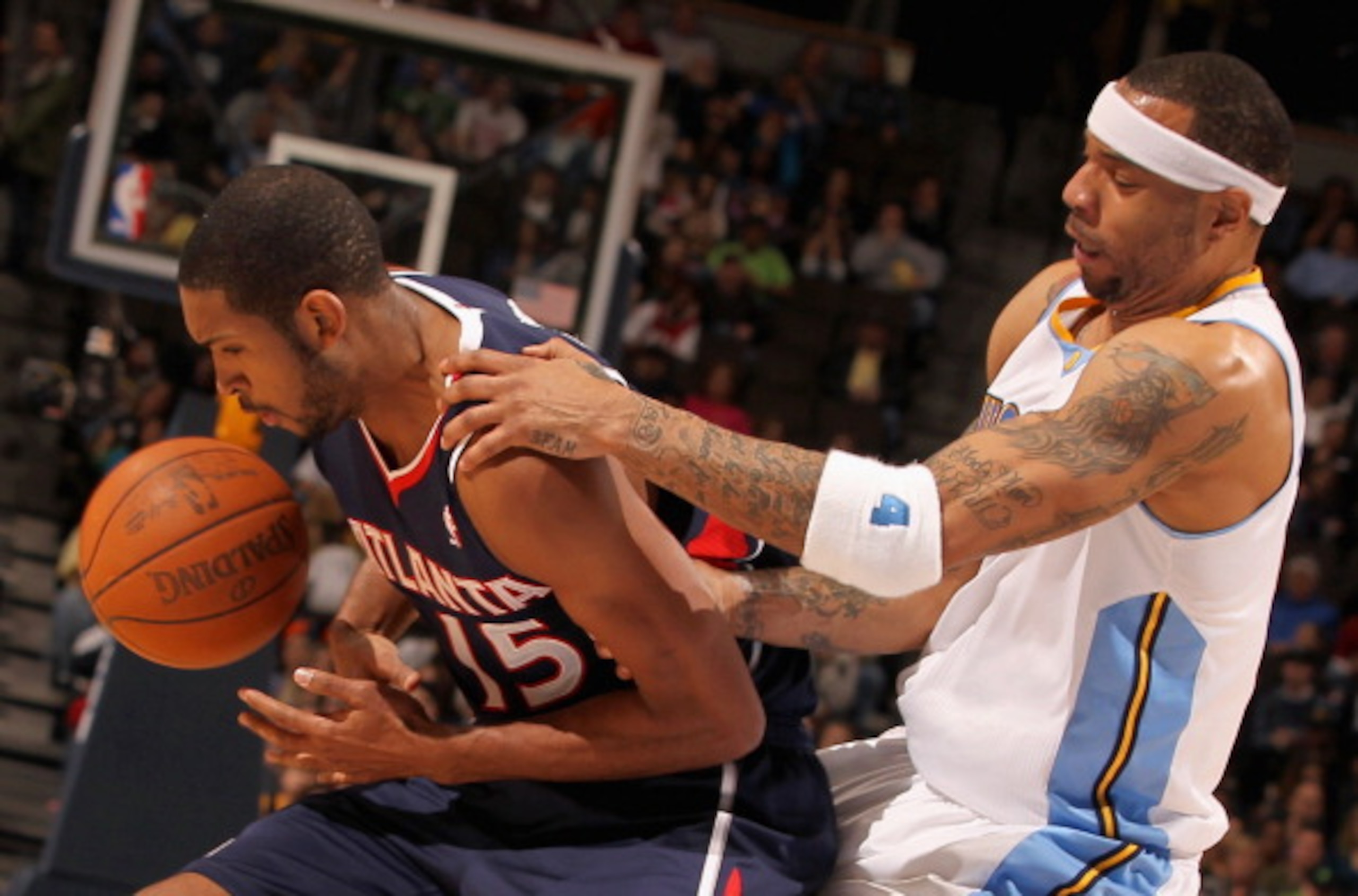 DENVER, CO - FEBRUARY 28: Kenyon Martin #4 of the Denver Nuggets battles with Al Horford #15 of the Atlanta Hawks for control of the ball during NBA action at the Pepsi Center on February 28, 2011 in Denver, Colorado. The Nuggets deafeated the Hawks 100- DENVER, CO - FEBRUARY 28: Kenyon Martin #4 of the Denver Nuggets battles with Al Horford #15 of the Atlanta Hawks for control of the ball during NBA action at the Pepsi Center on February 28, 2011 in Denver, Colorado. The Nuggets deafeated the Hawks 100-