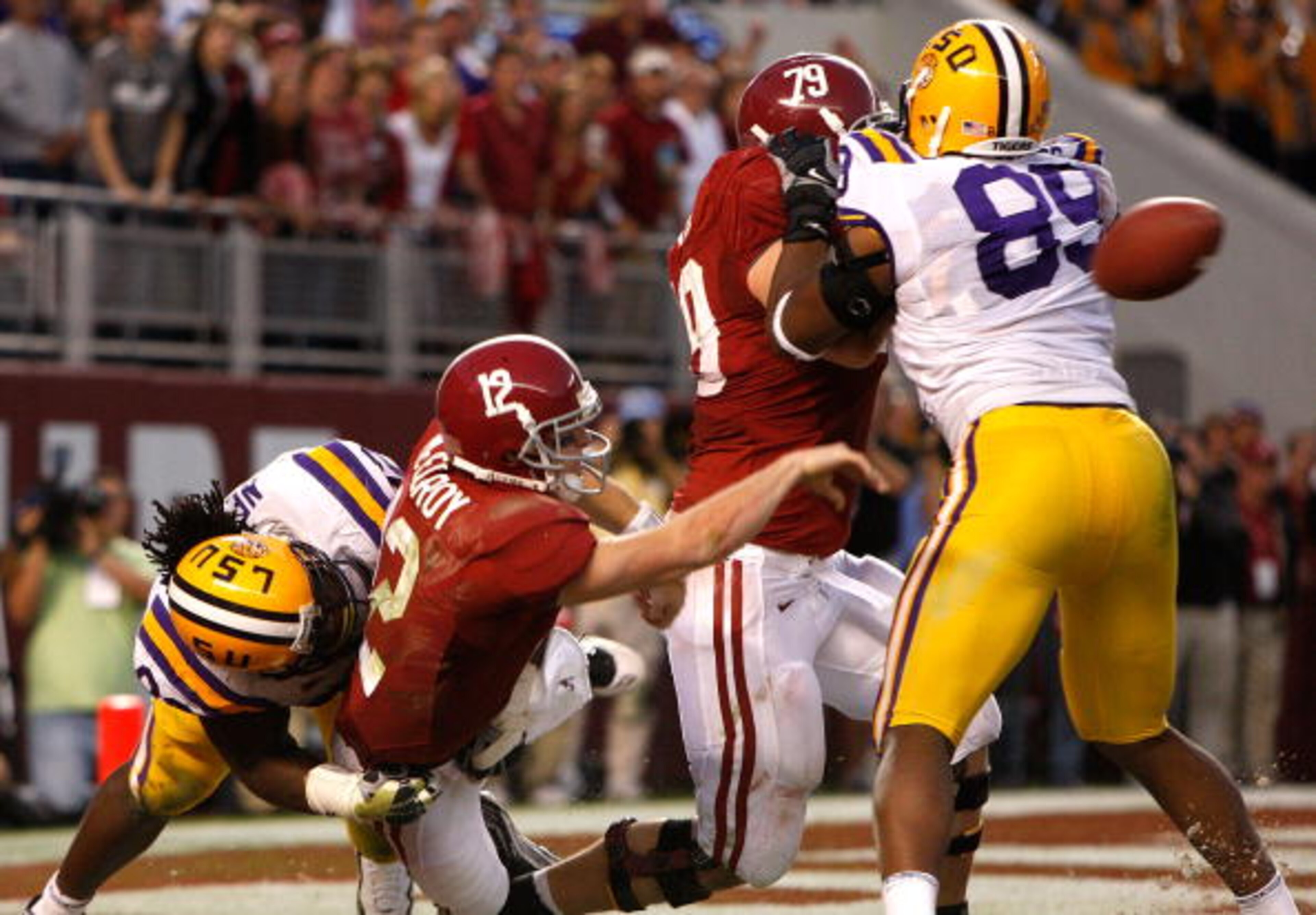 TUSCALOOSA, AL - NOVEMBER 07: Drake Nevis #92 of the Louisiana State University Tigers sacks quarterback Greg McElroy #12 of the Alabama Crimson Tide at Bryant-Denny Stadium on November 7, 2009 in Tuscaloosa, Alabama. McElroy was called for intentional TUSCALOOSA, AL - NOVEMBER 07: Drake Nevis #92 of the Louisiana State University Tigers sacks quarterback Greg McElroy #12 of the Alabama Crimson Tide at Bryant-Denny Stadium on November 7, 2009 in Tuscaloosa, Alabama. McElroy was called for intentional