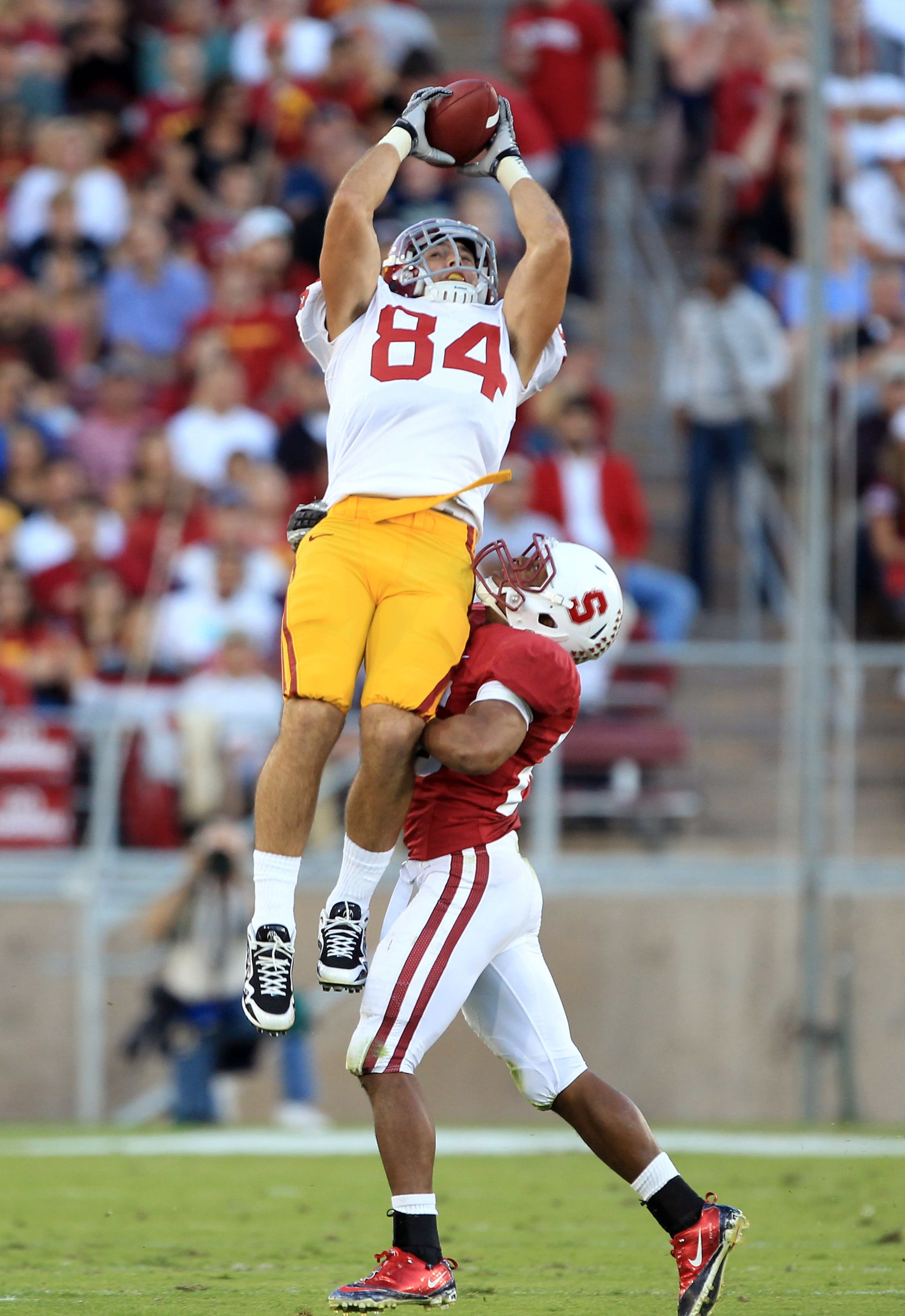 PALO ALTO, CA - OCTOBER 09: Jordan Cameron #84 of the USC Trojans leaps to catch a ball over Delano Howell #26 of the Stanford Cardinal at Stanford Stadium on October 9, 2010 in Palo Alto, California. Cameron lost control of the ball on the way back down PALO ALTO, CA - OCTOBER 09: Jordan Cameron #84 of the USC Trojans leaps to catch a ball over Delano Howell #26 of the Stanford Cardinal at Stanford Stadium on October 9, 2010 in Palo Alto, California. Cameron lost control of the ball on the way back down