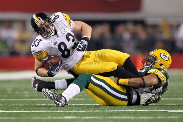 ARLINGTON, TX - FEBRUARY 06: Heath Miller #83 of the Pittsburgh Steelers is tackled after a catch by Desmond Bishop #55 of the Green Bay Packers during Super Bowl XLV at Cowboys Stadium on February 6, 2011 in Arlington, Texas.  (Photo by Jamie Squire/Gett