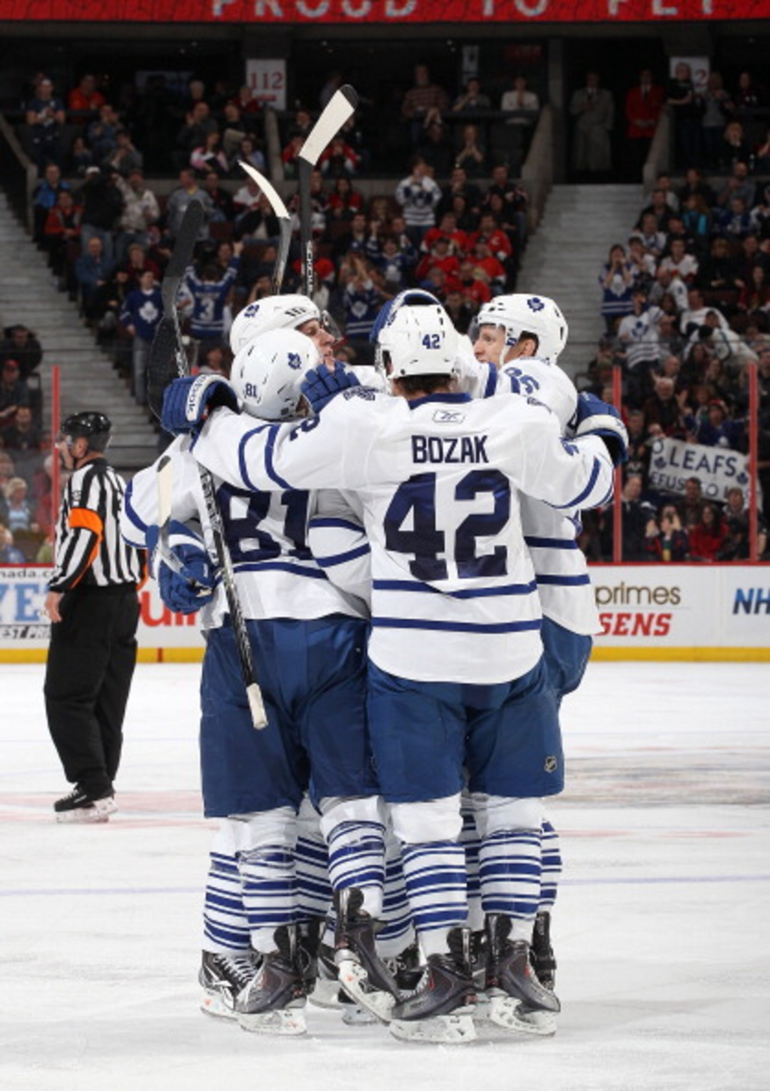OTTAWA, CANADA - APRIL 2: Tyler Bozak #42 of the Toronto Maple Leafs celebrates his third period goal with team mates Phil Kessel #81Carl Gunnarsson #36 against the Ottawa Senators at Scotiabank Place on April 2, 2011 in Ottawa, Ontario, Canada. (Photo b OTTAWA, CANADA - APRIL 2: Tyler Bozak #42 of the Toronto Maple Leafs celebrates his third period goal with team mates Phil Kessel #81Carl Gunnarsson #36 against the Ottawa Senators at Scotiabank Place on April 2, 2011 in Ottawa, Ontario, Canada. (Photo b