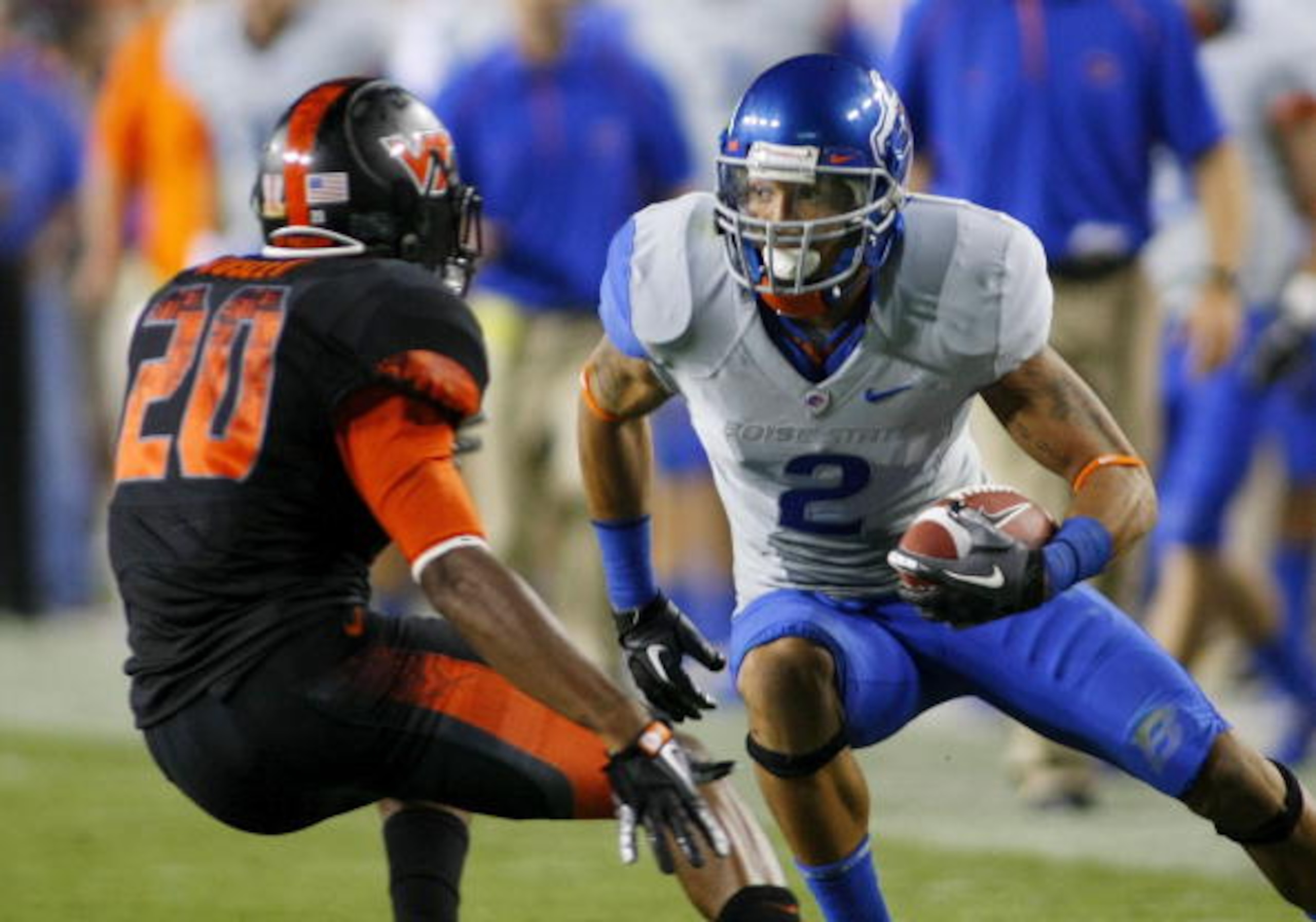LANDOVER, MD - SEPTEMBER 06: Wide receiver #2 Austin Pettis of the Boise State Broncos tries to avoid cornerback #21 Rashad Carmichael of the Virginia Tech Hokies at FedExField on September 6, 2010 in Landover, Maryland. (Photo by Geoff Burke/Getty Imag LANDOVER, MD - SEPTEMBER 06: Wide receiver #2 Austin Pettis of the Boise State Broncos tries to avoid cornerback #21 Rashad Carmichael of the Virginia Tech Hokies at FedExField on September 6, 2010 in Landover, Maryland. (Photo by Geoff Burke/Getty Imag