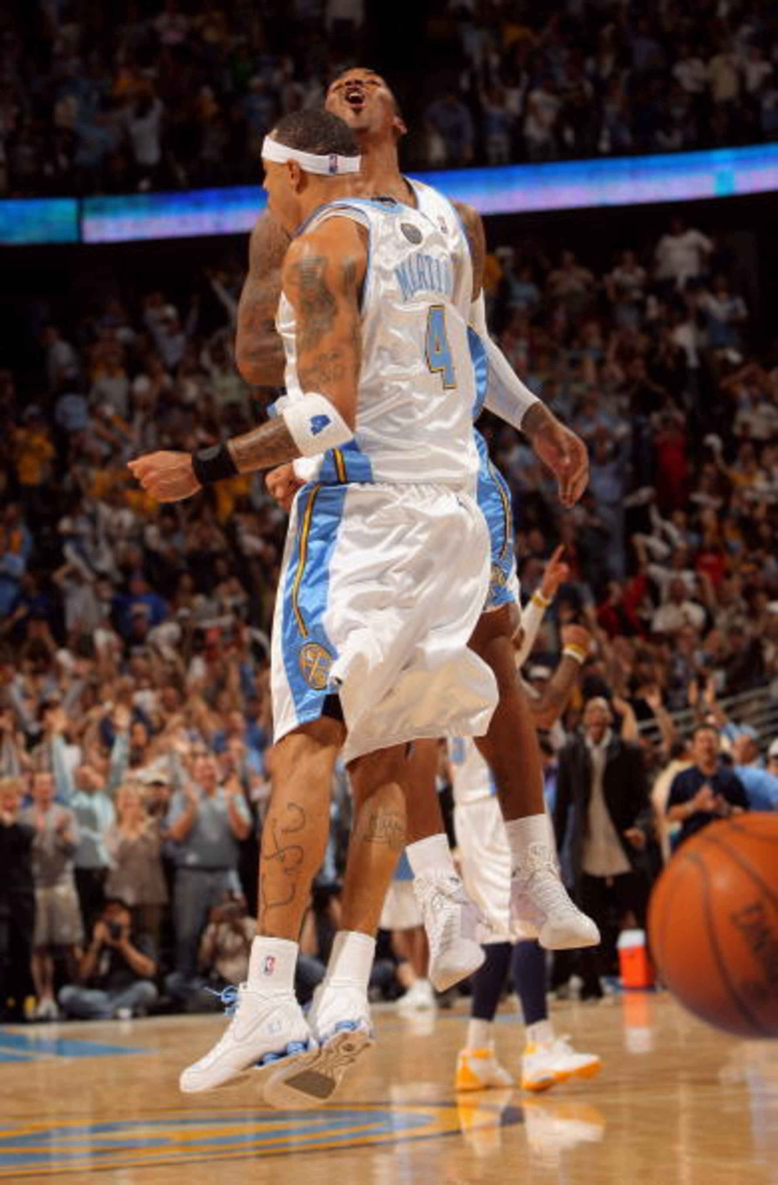 DENVER - MAY 13:  Kenyon Martin #4 and J.R. Smith #1 of the Denver Nuggets celebrate after a play against the Dallas Mavericks late in Game Five of the Western Conference Semifinals during the 2009 NBA Playoffs at Pepsi Center on May 13, 2009 in Denver, C