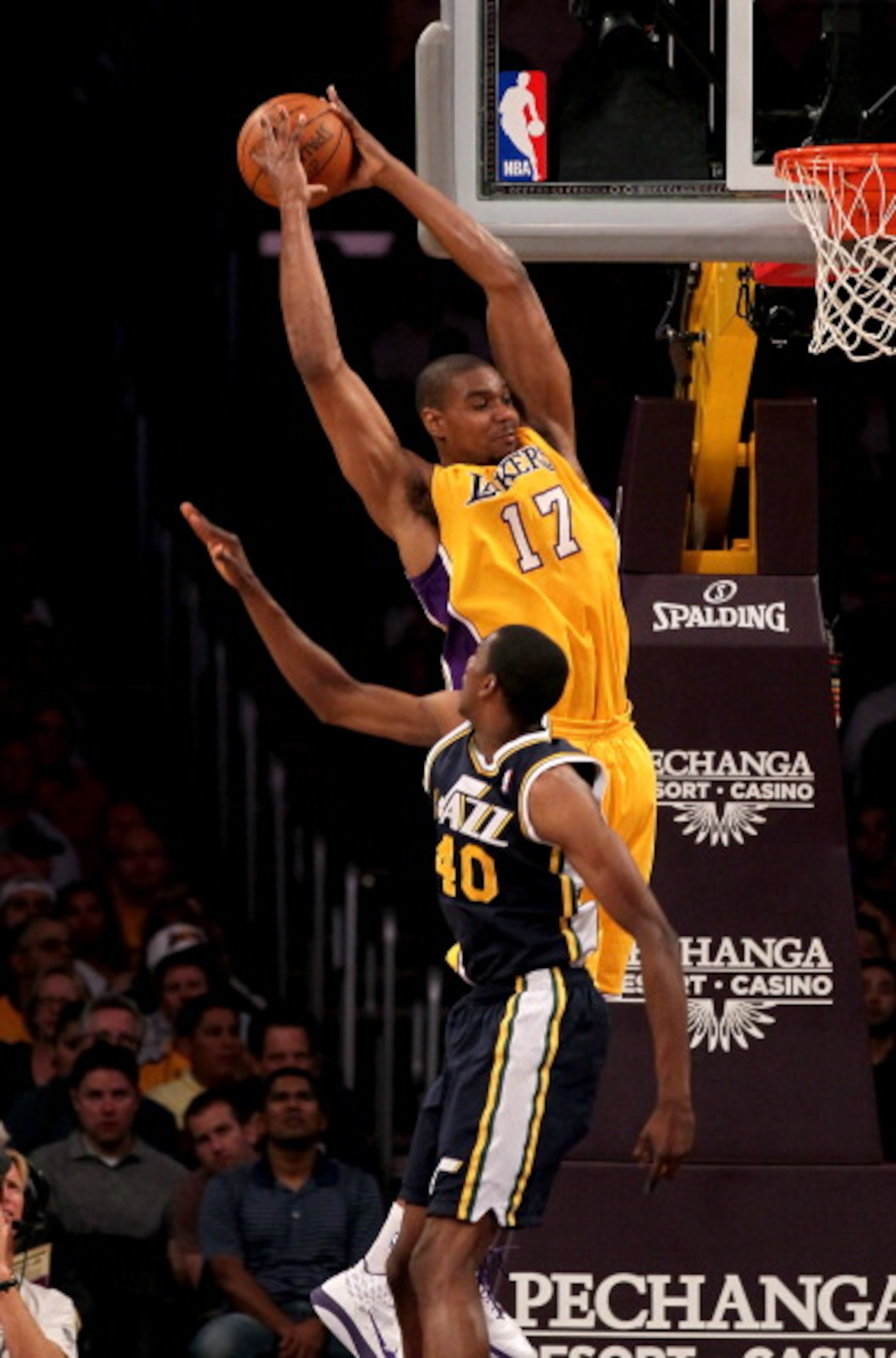 LOS ANGELES, CA - APRIL 5:  Andrew Bynum #17 of the Los Angeles Lakers jumps to catch a pass over Jeremy Evans #40 of the Utah Jazz at Staples Center on April 5, 2011 in Los Angeles, California.  NOTE TO USER: User expressly acknowledges and agrees that, 