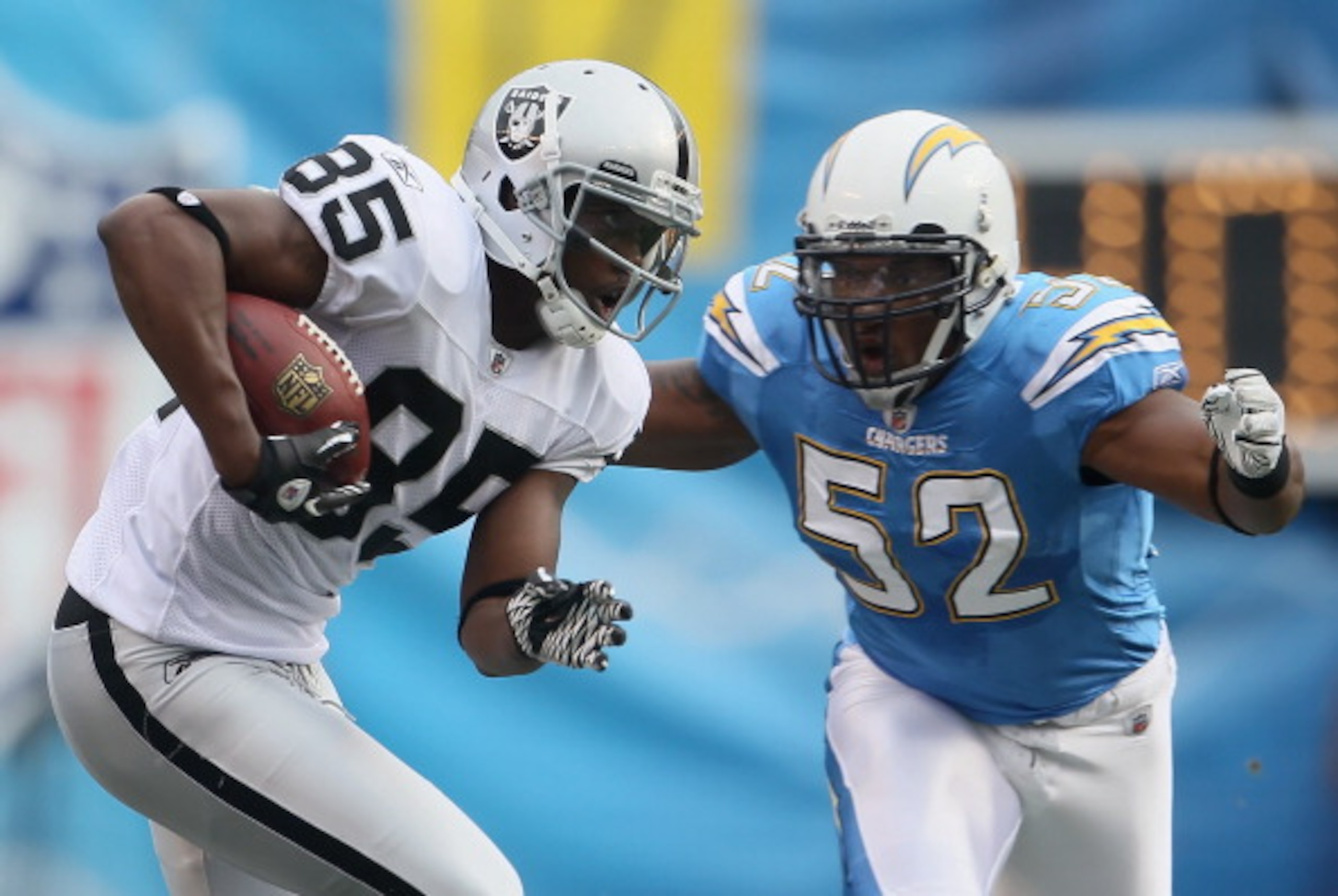 SAN DIEGO - DECEMBER 05: Darrius Heyward-Bey #85 of the Oakland Raiders is pursued by Larry English #52 of the San Diego Chargers in the second quarter at Qualcomm Stadium on December 5, 2010 in San Diego, California. The Raiders defeated the Chargers 28 SAN DIEGO - DECEMBER 05: Darrius Heyward-Bey #85 of the Oakland Raiders is pursued by Larry English #52 of the San Diego Chargers in the second quarter at Qualcomm Stadium on December 5, 2010 in San Diego, California. The Raiders defeated the Chargers 28