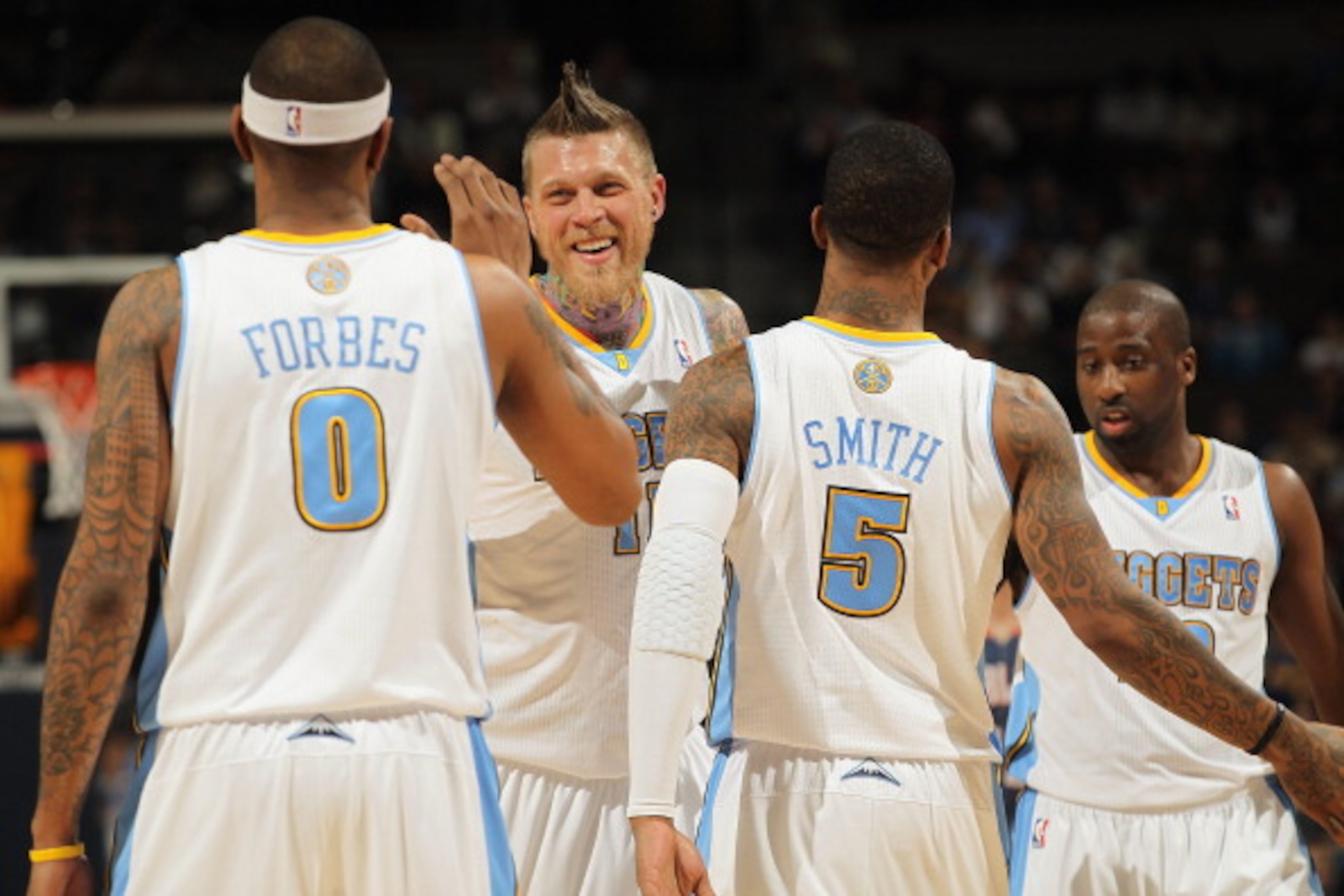 DENVER, CO - MARCH 02:  Gary Forbes #0, Chris Andersen #11, J.R. Smith #5 and Raymond Felton #20 of the Denver Nuggets celebrate against the Charlotte Bobcats at the Pepsi Center on March 2, 2011 in Denver, Colorado. The Nuggets defeated the Bobcats 120-8