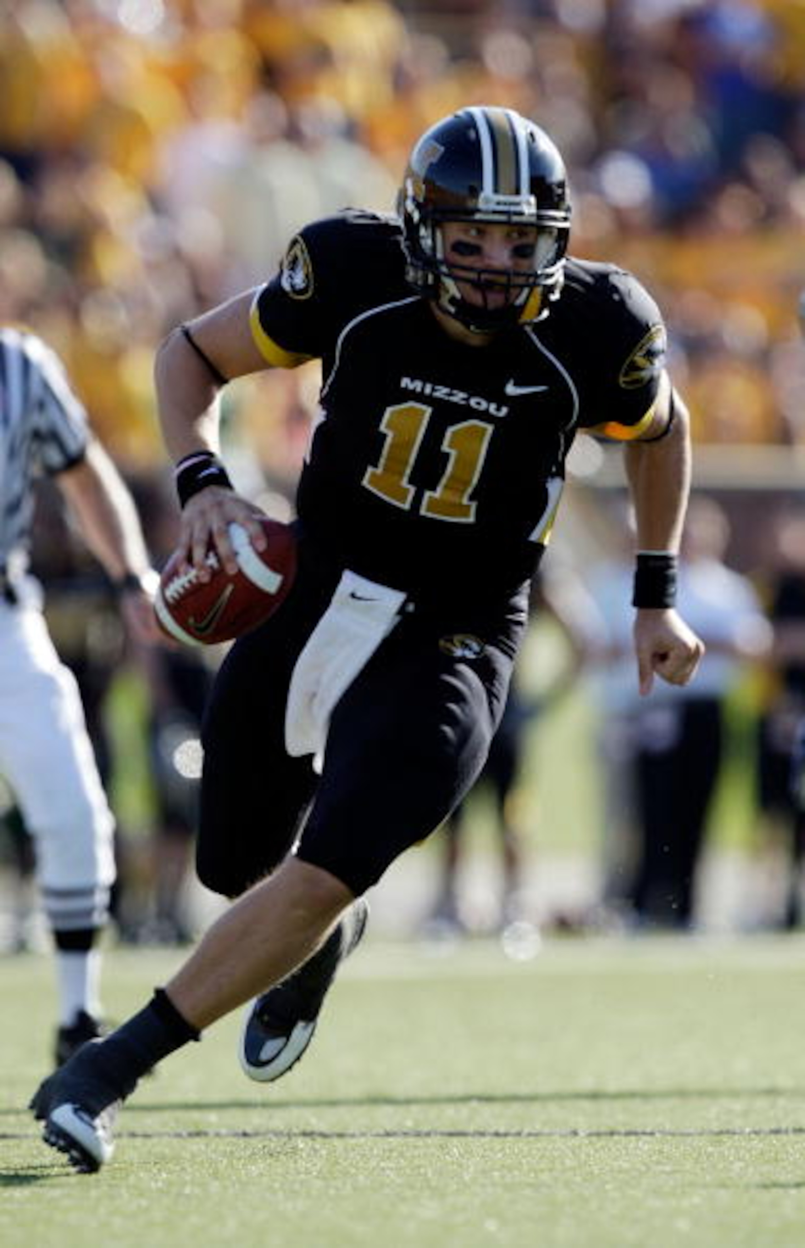 COLUMBIA, MO - NOVEMBER 07:  Quarterback Blaine Gabbert #11 of the Missouri Tigers rolls out during the game against the Baylor Bears at Faurot Field/Memorial Stadium on November 7, 2009 in Columbia, Missouri.  (Photo by Jamie Squire/Getty Images)