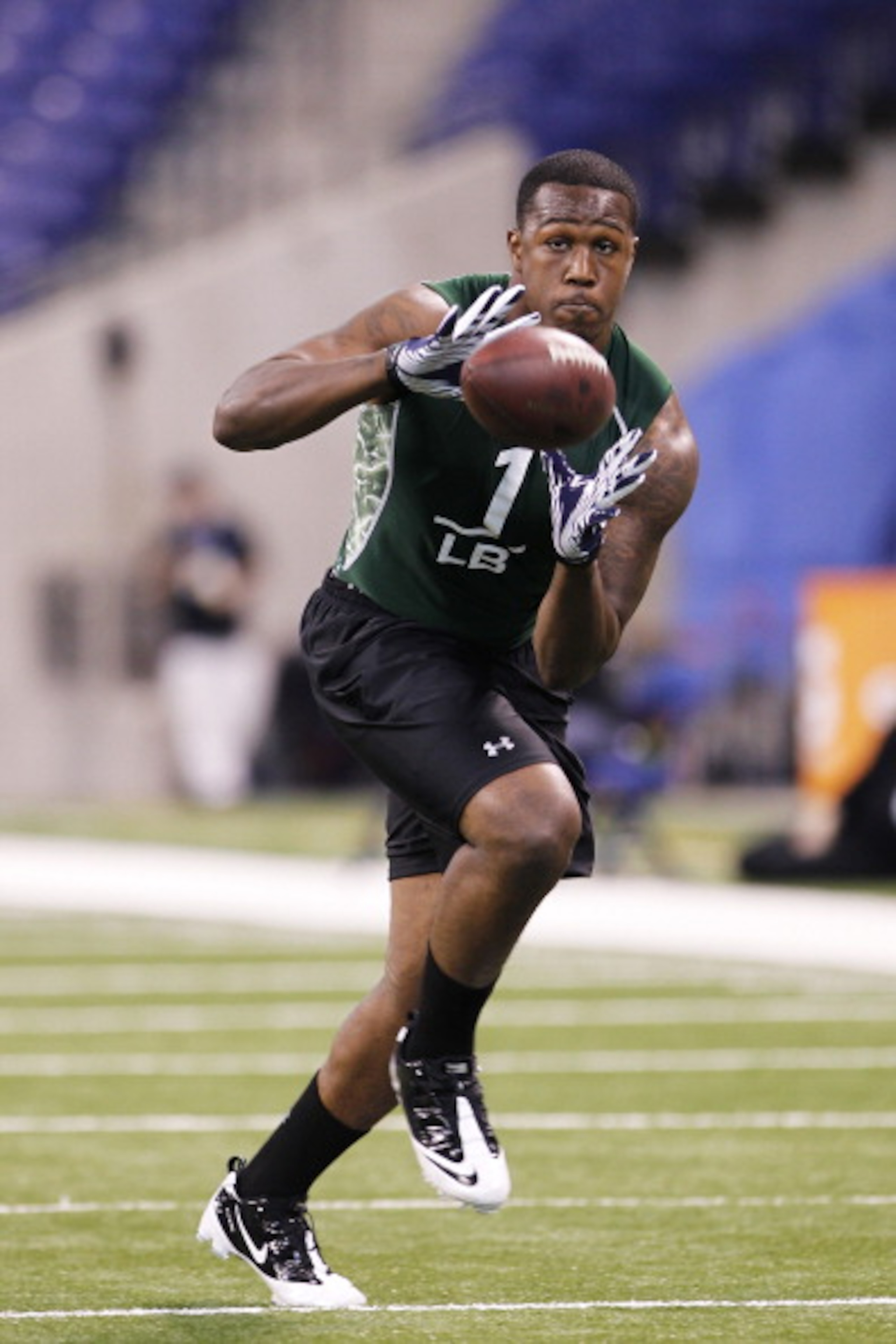 INDIANAPOLIS, IN - FEBRUARY 28: Akeem Ayers of UCLA works out during the 2011 NFL Scouting Combine at Lucas Oil Stadium on February 28, 2011 in Indianapolis, Indiana. (Photo by Joe Robbins/Getty Images)