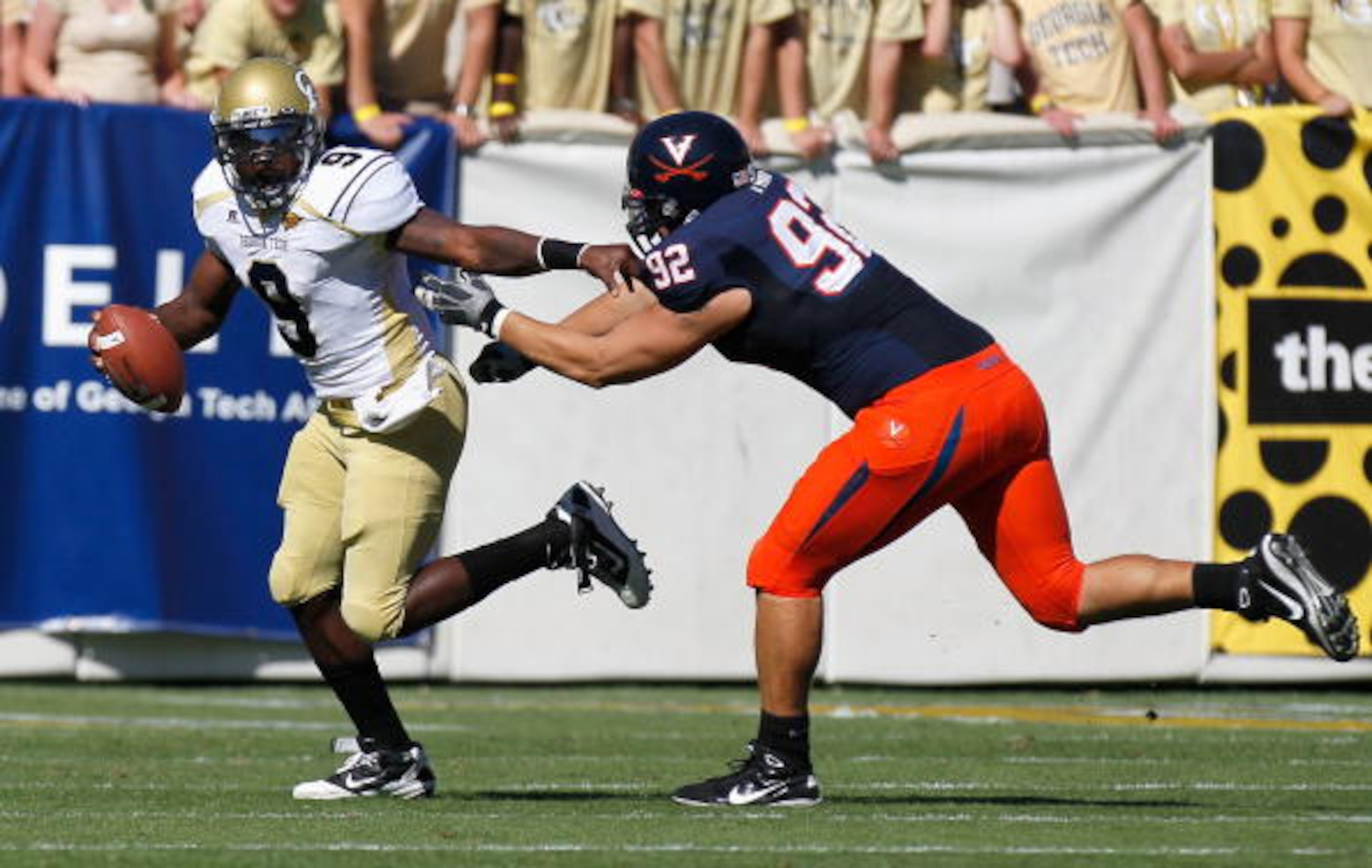 ATLANTA - OCTOBER 09:  Quarterback Joshua Nesbitt #9 of the Georgia Tech Yellow Jackets rushes away from Zane Parr #92 of the Virginia Cavaliers at Bobby Dodd Stadium on October 9, 2010 in Atlanta, Georgia.  (Photo by Kevin C. Cox/Getty Images)