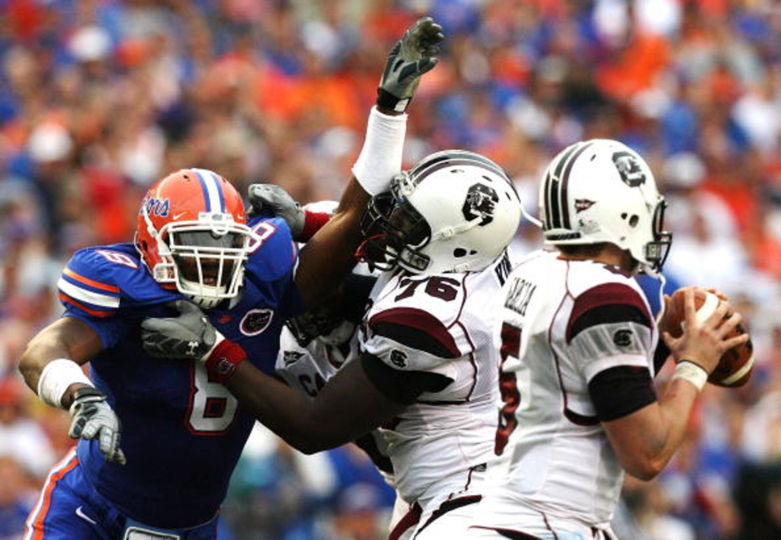 GAINESVILLE, FL - NOVEMBER 15:  Offensive lineman Jarriel King #76 the South Carolina Gamecocks tries to protect his quarterback Stephen Garcia #5 from defensive end Carlos Dunlap #8 of the Florida Gators at Ben Hill Griffin Stadium on November 15, 2008 i