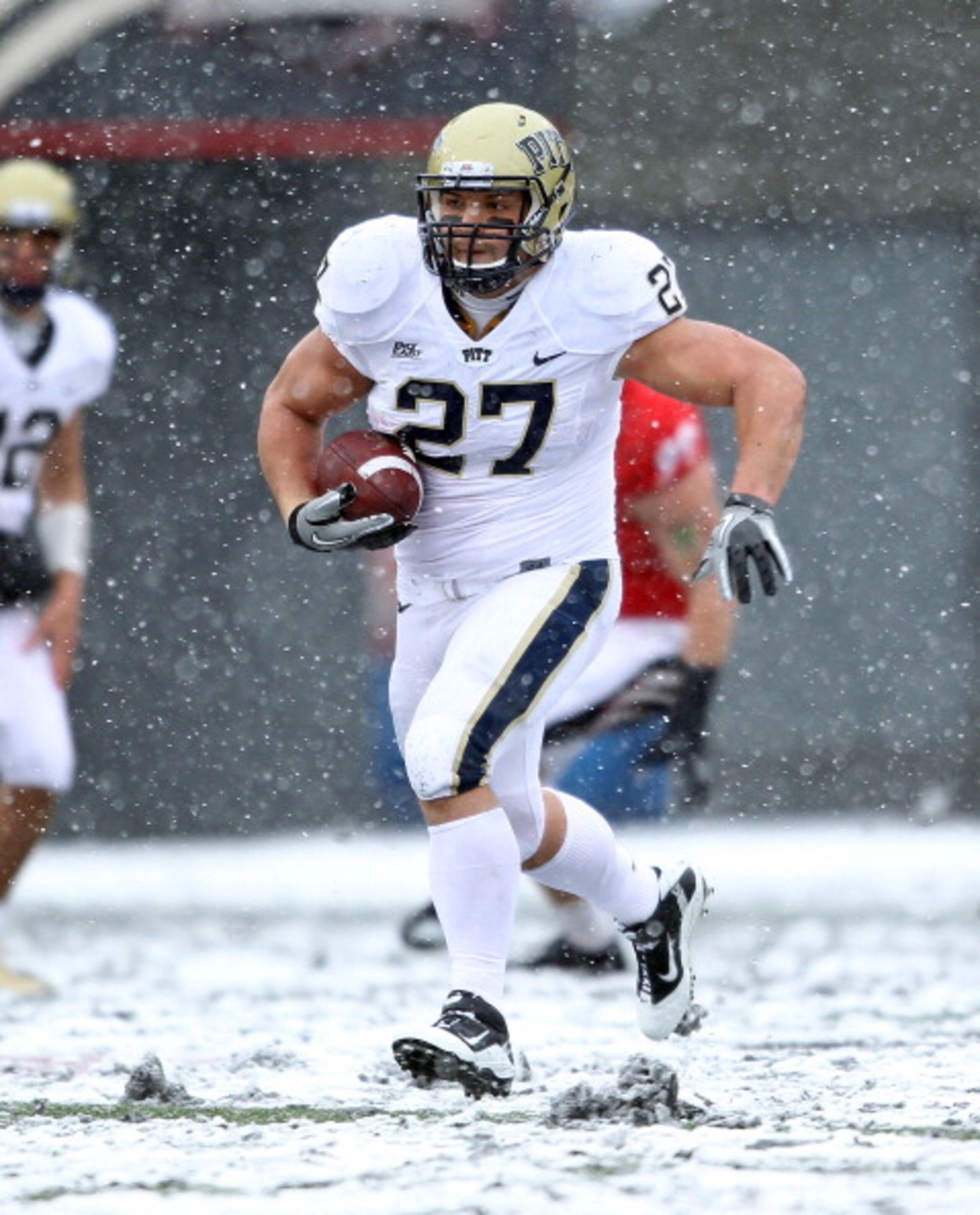 CINCINNATI, OH - DECEMBER 04:  Henry Hynoski #27 of the Pittsburgh Panthers runs with the ball during the Big East Conference game against the Cincinnati Bearcats at Nippert Stadium on December 4, 2010 in Cincinnati, Ohio.  Pittsburgh won 28-10.  (Photo b