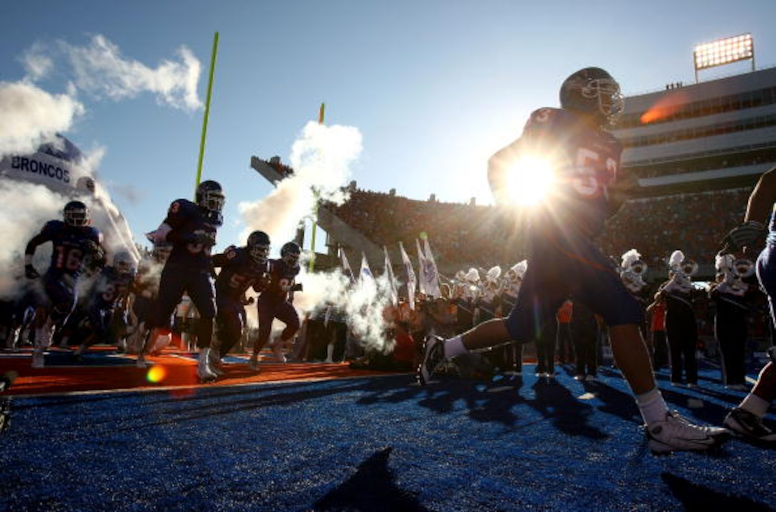 BOISE , ID - SEPTEMBER 13: Players of the Boise State Broncos run onto the field before the start of the game against the Bowling Green Falcons at Bronco Stadium on September 13, 2008 in Boise, Idaho. (Photo by Jonathan Ferrey/Getty Images)