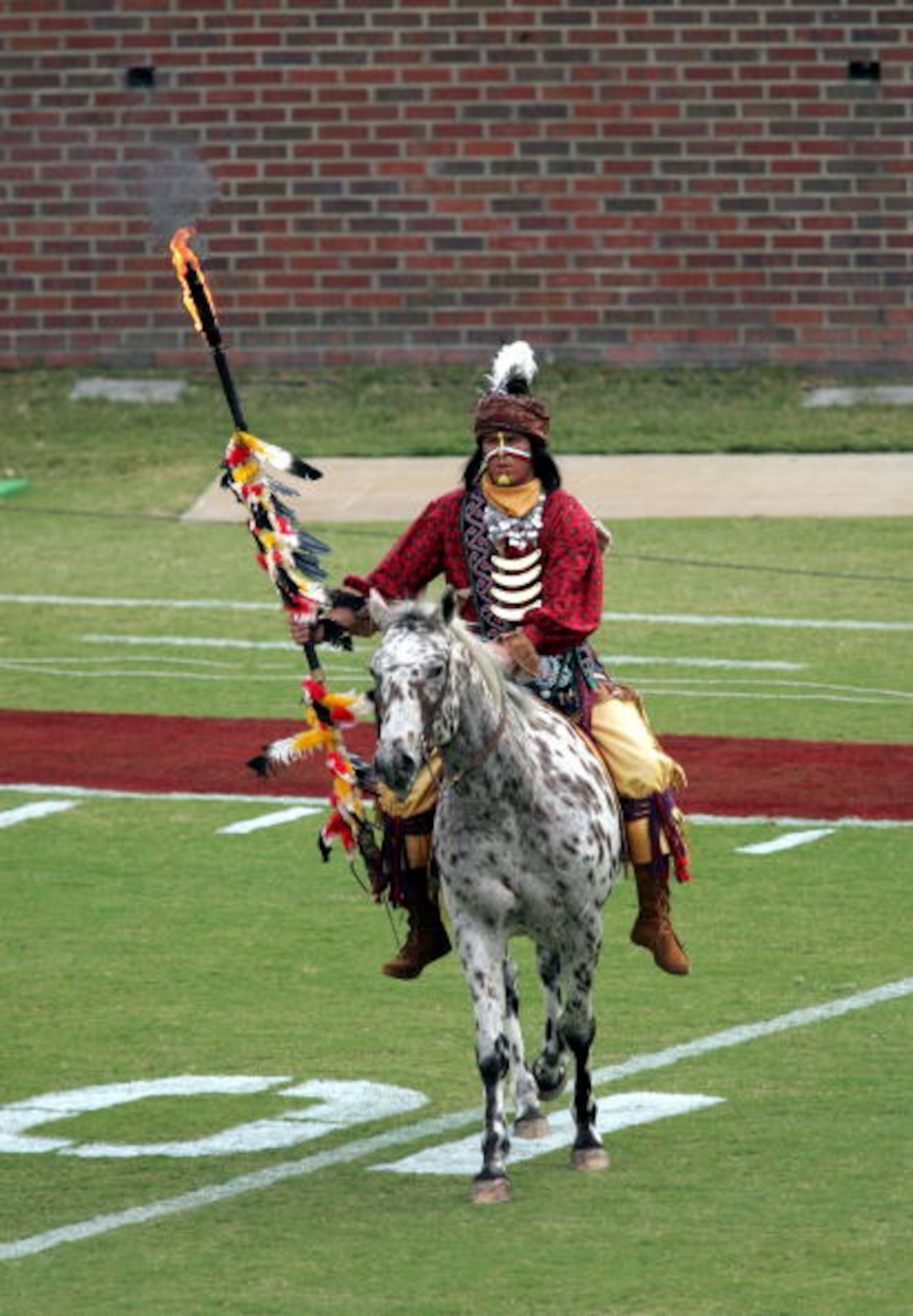 TALLAHASSEE, FL - NOVEMBER 05:  Chief Osceola and his horse Renagade perform on the field before the visiting North Carolina State Wolfpack take on the Florida State Seminoles at Doak Campbell Stadium on November 5, 2005 in Tallahassee, Florida. NC State