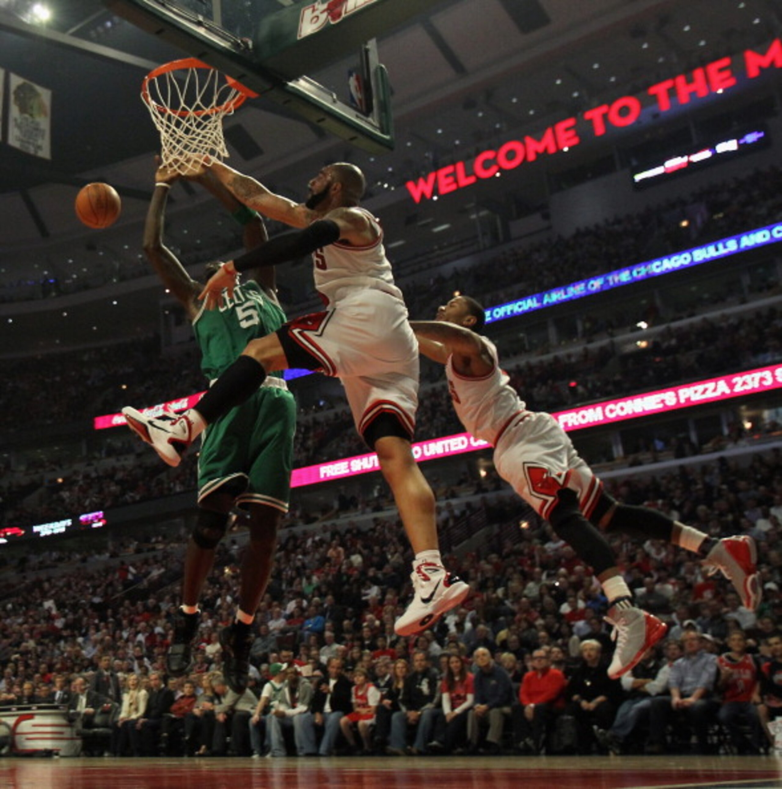 CHICAGO, IL - APRIL 07: Derrick Rose #1 (R) and Carlos Boozer #5 of the Chicago Bulls leap to block a shot by Kevin Garnett #5 of the Boston Celtics at United Center on April 7, 2011 in Chicago, Illinois. NOTE TO USER: User expressly acknowledges and agre CHICAGO, IL - APRIL 07: Derrick Rose #1 (R) and Carlos Boozer #5 of the Chicago Bulls leap to block a shot by Kevin Garnett #5 of the Boston Celtics at United Center on April 7, 2011 in Chicago, Illinois. NOTE TO USER: User expressly acknowledges and agre