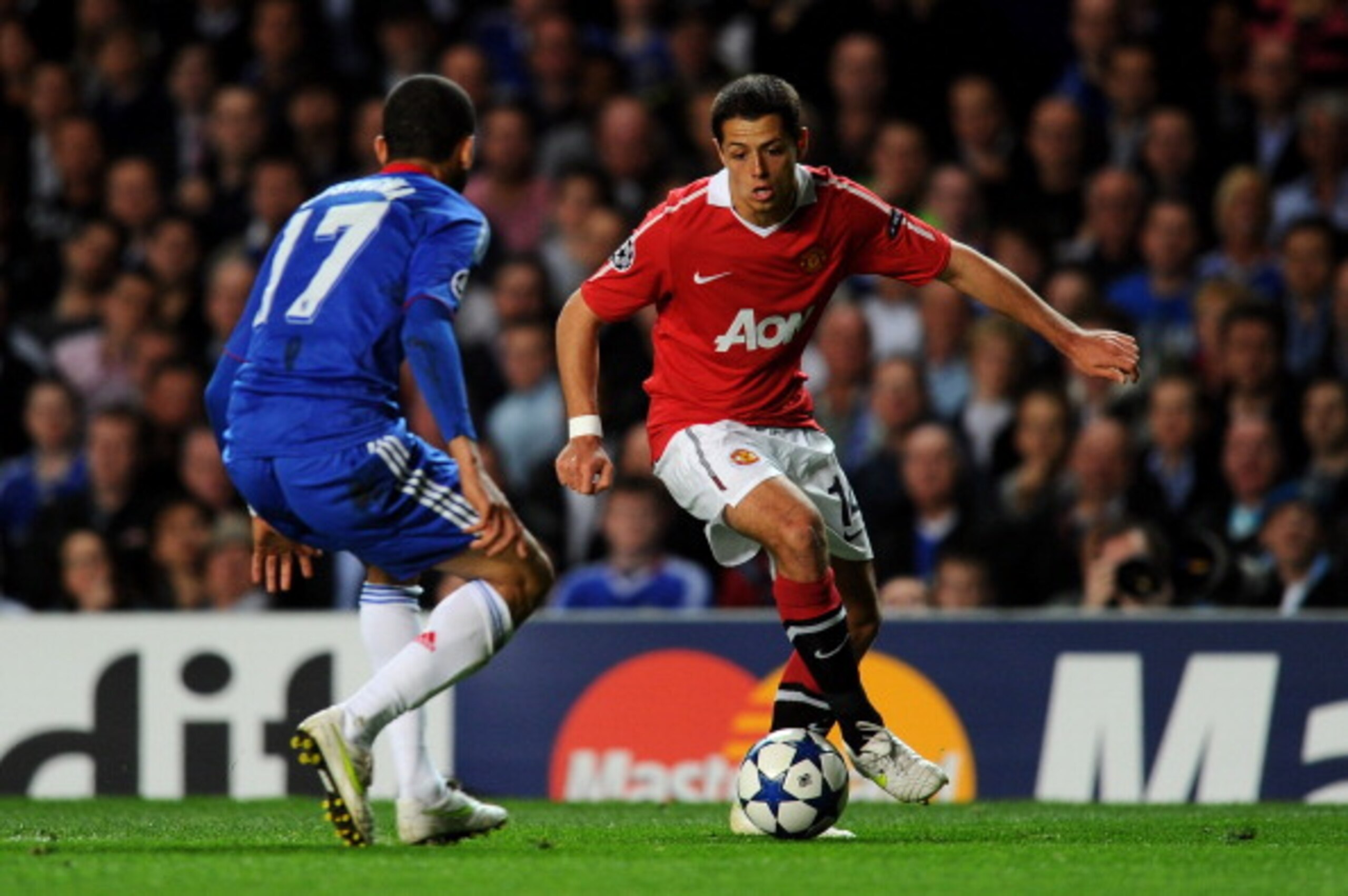 LONDON, ENGLAND - APRIL 06:  Javier Hernandez of Manchester United is challenged by Jose Bosingwa of Chelsea during the UEFA Champions League quarter final first leg match between Chelsea and Manchester United at Stamford Bridge on April 6, 2011 in London