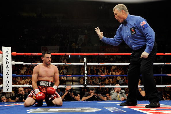 LAS VEGAS - JULY 31:  Referee Jay Nady counts as Robert Guerrero kneels on the canvas after being hit by Joel Casamayor in the 10th round of their junior welterweight fight at the Mandalay Bay Events Center July 31, 2010 in Las Vegas, Nevada. Guerrero won