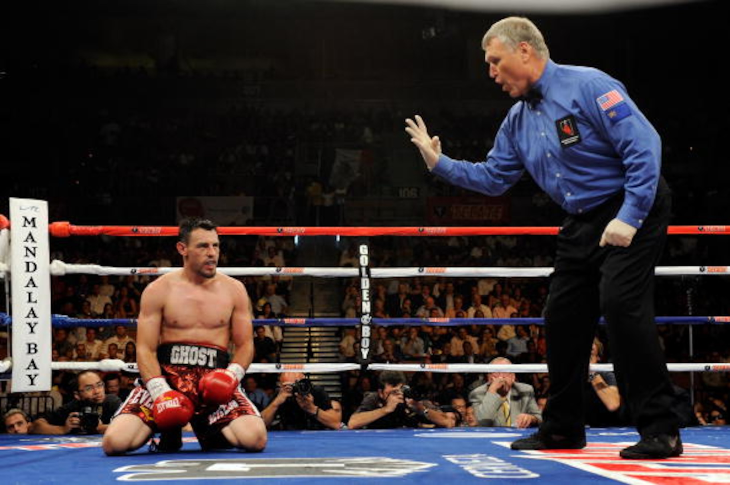 LAS VEGAS - JULY 31:  Referee Jay Nady counts as Robert Guerrero kneels on the canvas after being hit by Joel Casamayor in the 10th round of their junior welterweight fight at the Mandalay Bay Events Center July 31, 2010 in Las Vegas, Nevada. Guerrero won