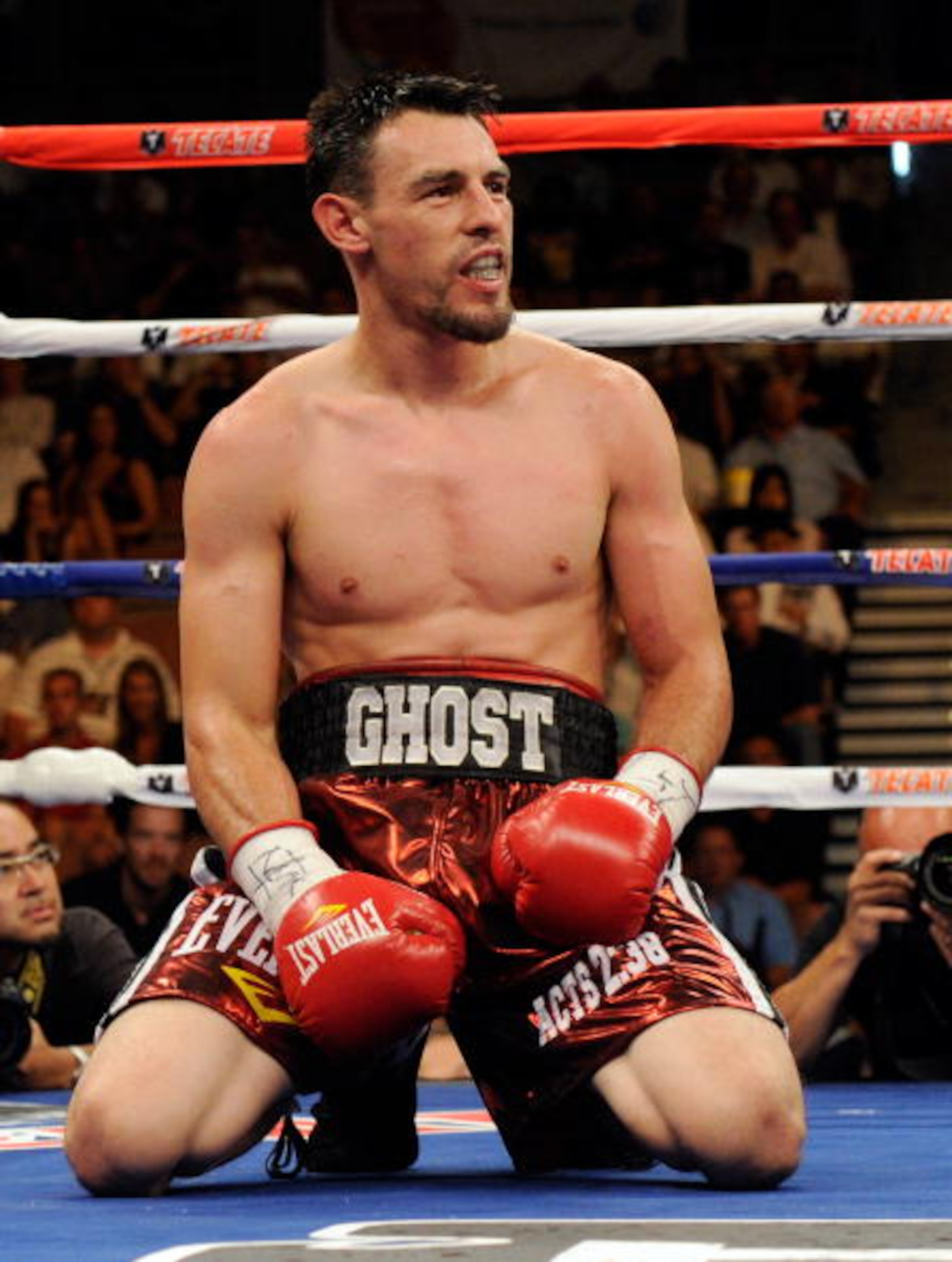LAS VEGAS - JULY 31:  Robert Guerrero kneels on the canvas after being hit by Joel Casamayor in the 10th round of their junior welterweight fight at the Mandalay Bay Events Center July 31, 2010 in Las Vegas, Nevada. Guerrero won by unanimous decision.  (P
