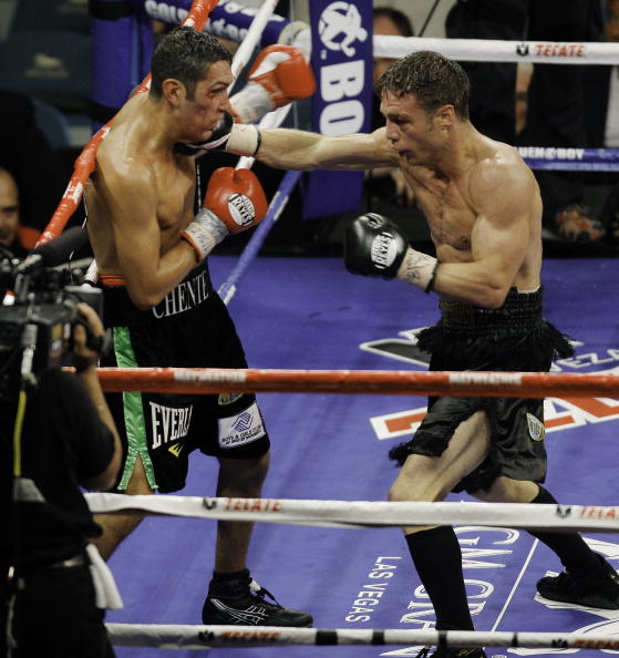 LAS VEGAS - SEPTEMBER 19:  Michael Katsidis (R) trades punches with Vincent Escobedo during their WBO interim lightweight title fight at the MGM Grand Garden Arena September 19, 2009 in Las Vegas, Nevada. Katsidis won by split decision.  (Photo by Eric Ja