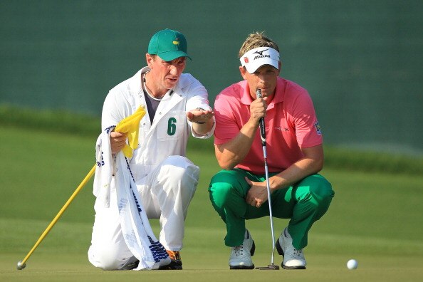 AUGUSTA, GA - APRIL 09:  Luke Donald of England (R) and caddie John McLaren line up a putt on the 17th green during the third round of the 2011 Masters Tournament at Augusta National Golf Club on April 9, 2011 in Augusta, Georgia.  (Photo by David Cannon/