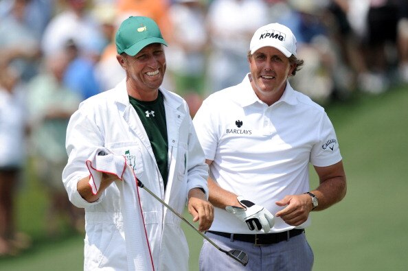 AUGUSTA, GA - APRIL 09:  Phil Mickelson chats with his caddie Jim Mackay on the second hole during the third round of the 2011 Masters Tournament at Augusta National Golf Club on April 9, 2011 in Augusta, Georgia.  (Photo by Harry How/Getty Images)