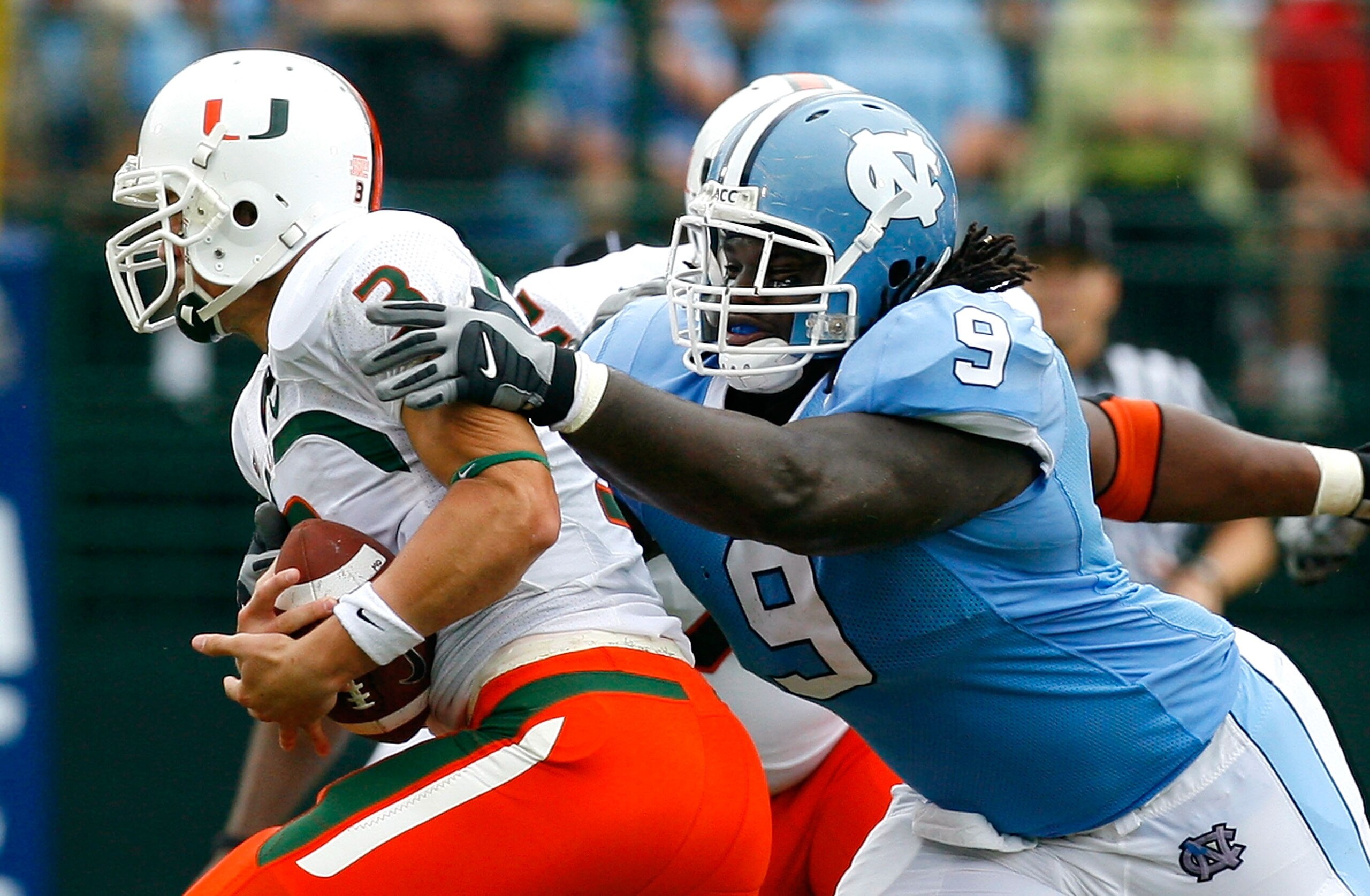 CHAPEL HILL, NC - OCTOBER 06:  Defensive tackle Marvin Austin #9 of the North Carolina Tar Heels sacks quarterback Kyle Wright #3 of the Miami Hurricanes during the first half at Kenan Stadium on October 6, 2007 in Chapel Hill, North Carolina.  (Photo by