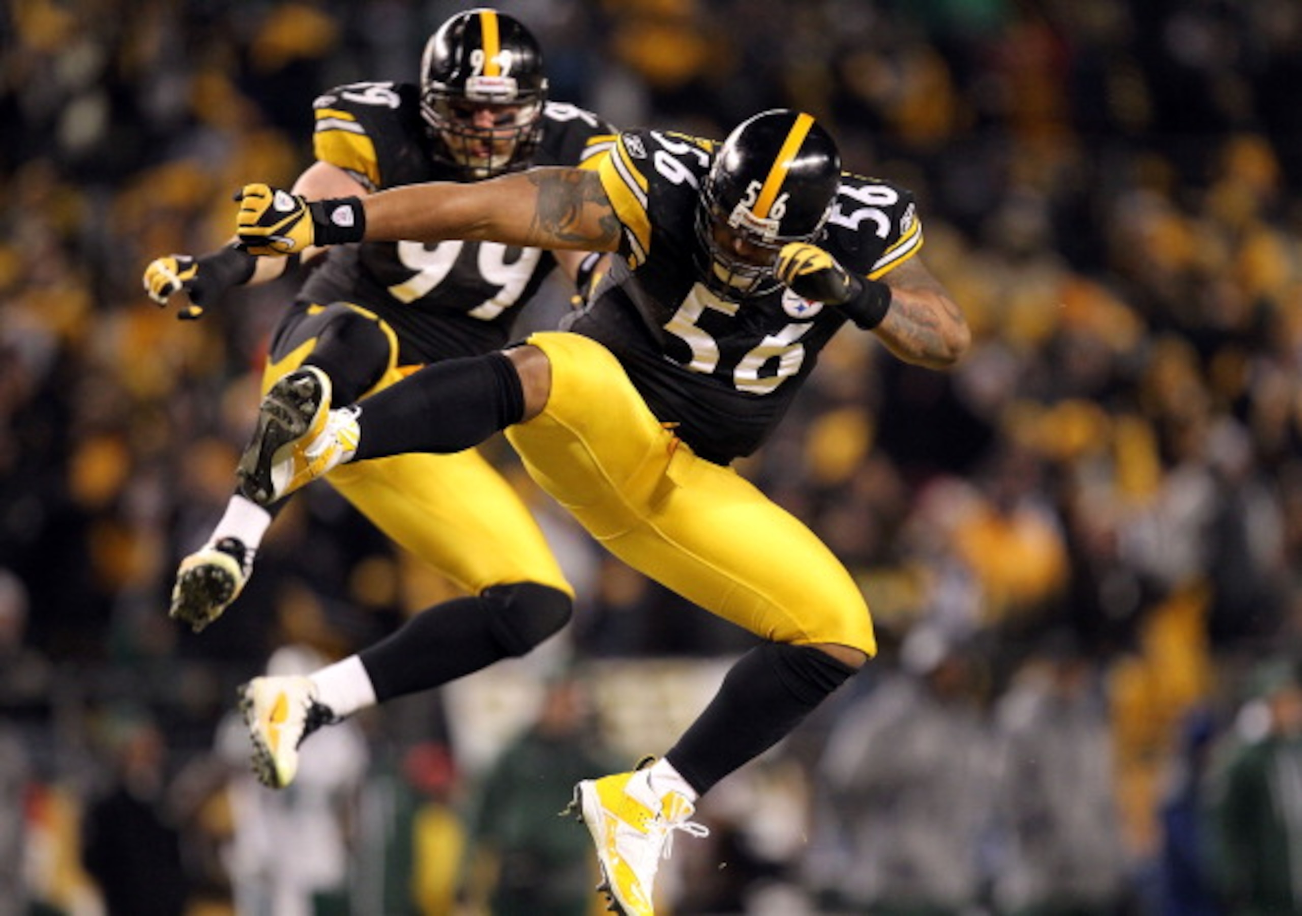 PITTSBURGH, PA - JANUARY 23:  LaMarr Woodley #56 and Brett Keisel #99 of the Pittsburgh Steelers celebrate after sacking Mark Sanchez #6 of the New York Jets during the 2011 AFC Championship game at Heinz Field on January 23, 2011 in Pittsburgh, Pennsylva