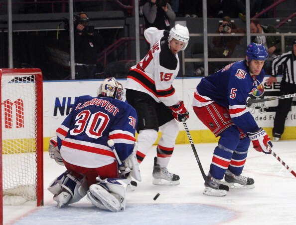 NEW YORK, NY - APRIL 09: Henrik Lundqvist #30 of the New York Rangers stops a shot by Travis Zajac #19 of the New Jersey Devils at Madison Square Garden on April 9, 2011 in New York City. The Rangers defeated the Devils 5-2. (Photo by Jonathan Klein/Getty