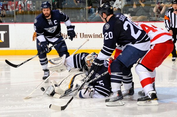 NASHVILLE, TN - APRIL 02:  Todd Bertuzzi #44 of the Detroit Red Wings fights through the defense of Ryan Suter #20 and Shea Weber #6 of the Nashville Predators to get a shot on Predators goalie Pekka Rinne #35 on April 2, 2011 at the Bridgestone Arena in