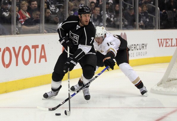 LOS ANGELES, CA - APRIL 09:  Rob Scuderi #7 of the Los Angeles Kings is pursued by Corey Perry #10 of the Anaheim Ducks for the puck in the first period at Staples Center on April 9, 2011 in Los Angeles, California.  (Photo by Jeff Gross/Getty Images)