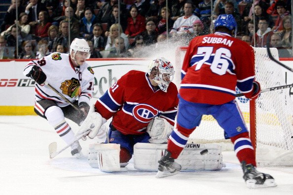 MONTREAL, CANADA - APRIL 5:  Carey Price #31 of the Montreal Canadiens stops the puck in front of Jonathan Toews #19 of the Chicago Blackhawks and team mate P.K. Subban #76 during the NHL game at the Bell Centre on April 5, 2011 in Montreal, Quebec, Canad