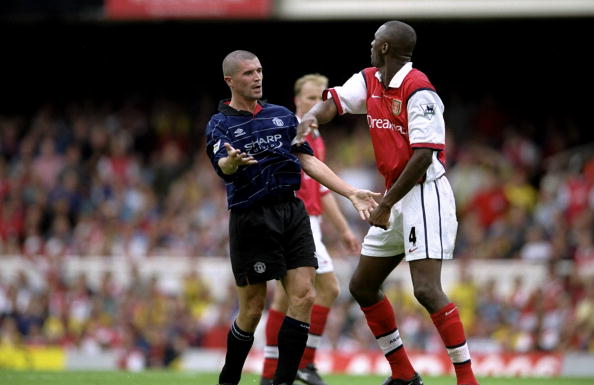 22 Aug 1999:  Roy Keane of Manchester United clashes with Patrick Vieira of Arsenal during the FA Carling Premiership match against Arsenal played at Highbury in London, England.  The match finished in a 2-1 win to Manchester United.  \ Mandatory Credit:C
