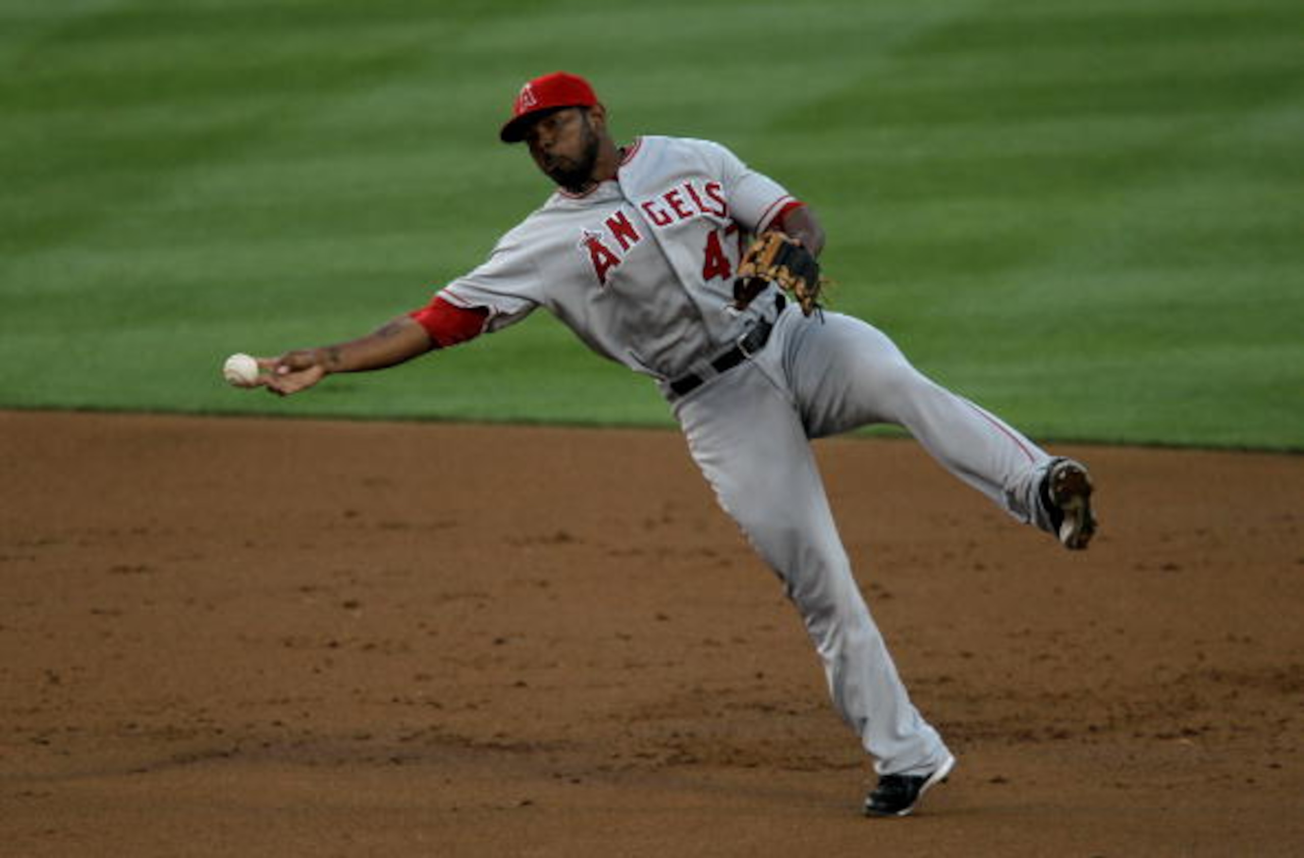 LOS ANGELES - JUNE 12: Second baseman Howie Kendrick #47 of the Los Angeles Angels of Anaheim throws to first after fielding a ground ball from James Loney #7 of the Los Angeles Dodgers on June 12, 2010 at Dodger Stadium in Los Angeles, California. (P LOS ANGELES - JUNE 12: Second baseman Howie Kendrick #47 of the Los Angeles Angels of Anaheim throws to first after fielding a ground ball from James Loney #7 of the Los Angeles Dodgers on June 12, 2010 at Dodger Stadium in Los Angeles, California. (P
