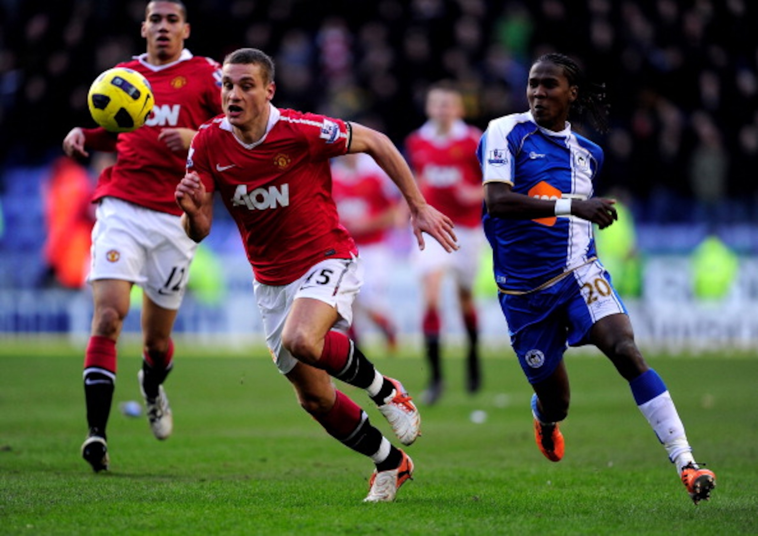 WIGAN, ENGLAND - FEBRUARY 26:  Hugo Rodallega of Wigan Athletic competes with Nemanja Vidic of Manchester United during the Barclays Premier League match between Wigan Athletic and Manchester United at the DW Stadium on February 26, 2011 in Wigan, England