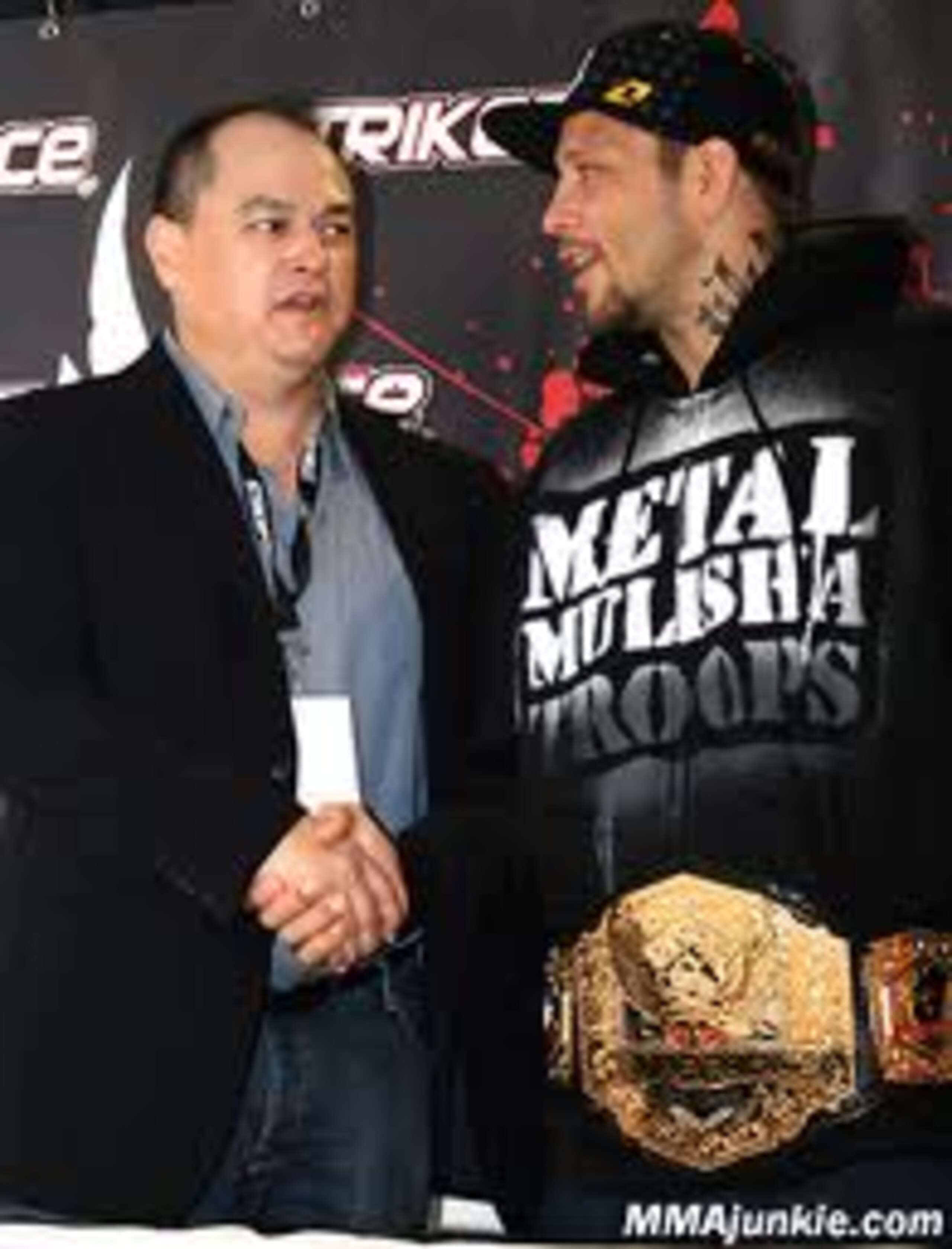 Scott Coker shaking hands with Renata Sobral courtesy of MMAjunkie