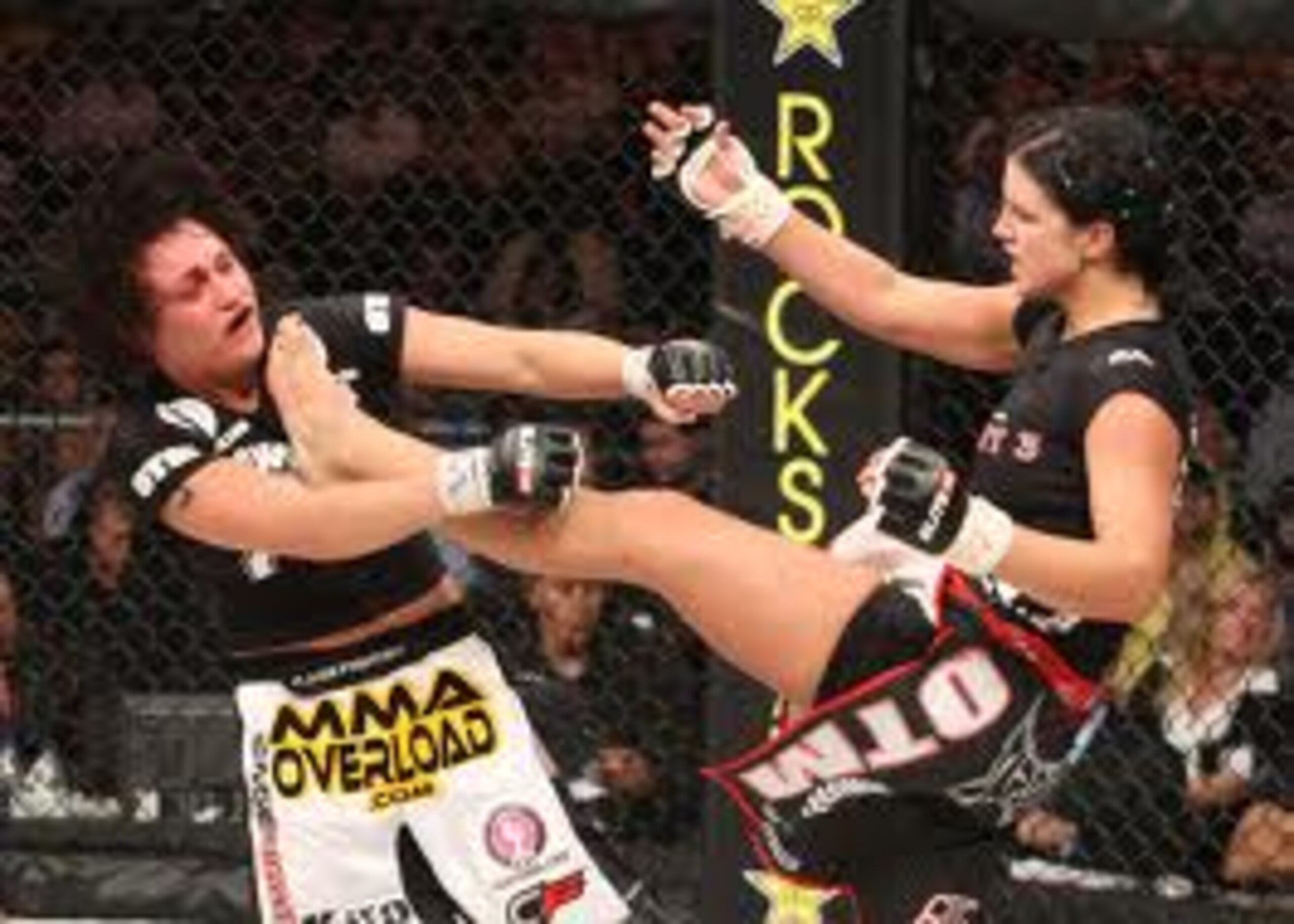 Gina Carano lands a vicious front kick Gina Carano lands a vicious front kick