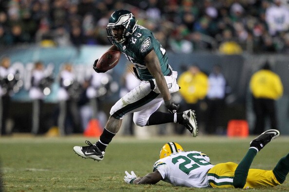 PHILADELPHIA, PA - JANUARY 09:  LeSean McCoy #25 of the Philadelphia Eagles avoids the tackle of Charlie Peprah #26 of the Green Bay Packers during the 2011 NFC wild card playoff game at Lincoln Financial Field on January 9, 2011 in Philadelphia, Pennsylv