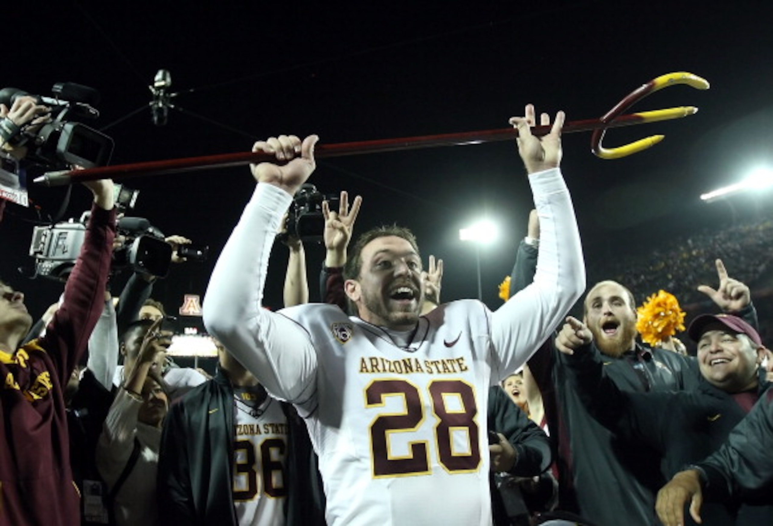 TUCSON, AZ - DECEMBER 02:  Kicker Thomas Weber #28 of the Arizona State Sun Devils celebrates holding the pitchfork after defeating the Arizona Wildcats in college football game at Arizona Stadium on December 2, 2010 in Tucson, Arizona. The Sun Devils def