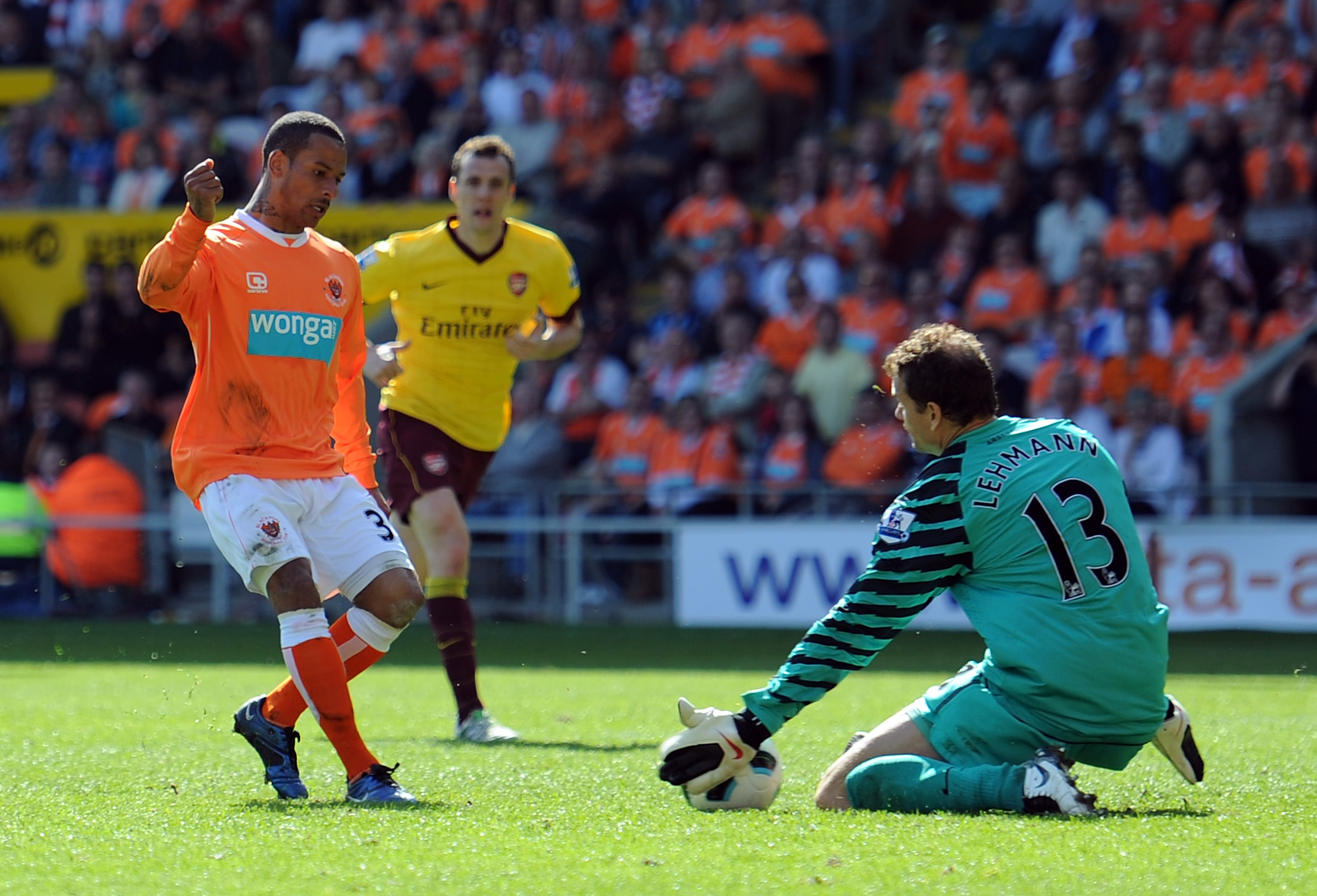 BLACKPOOL, ENGLAND - APRIL 10:  Jens Lehmann of Arsenal saves the shot of DJ Campbell of Blackpool during the Barclays Premier League match between Blackpool and Arsenal at Bloomfield Road on April 10, 2011 in Blackpool, England.  (Photo by Chris Brunskil
